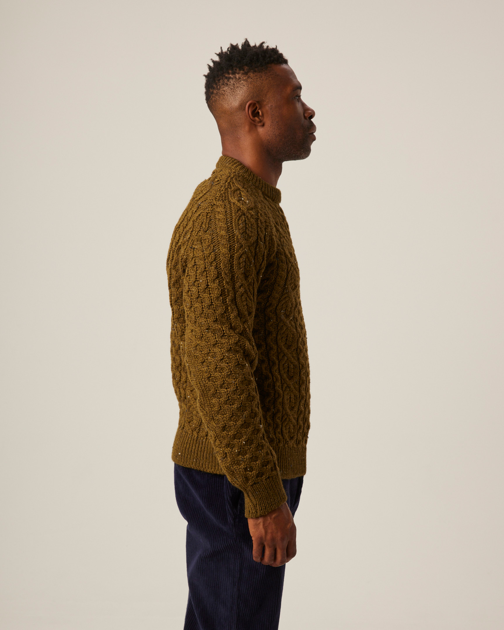 Image of model wearing Hudson Aran Jumper. Model is 6ft1in, chest size 38in and wearing size Medium