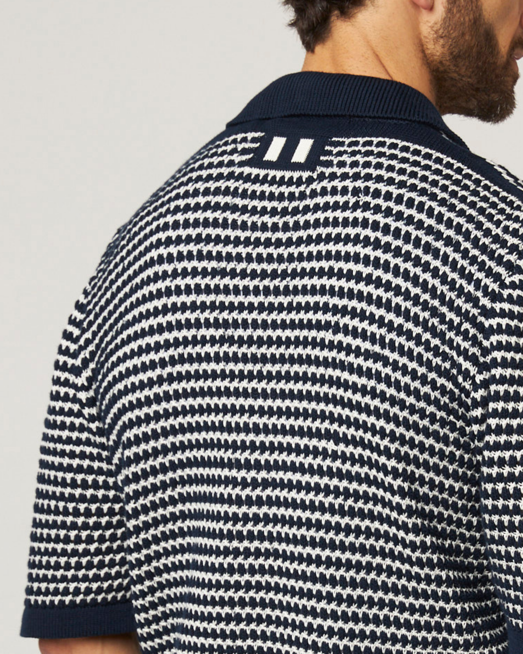 Image of model wearing Island Crochet Shirt. 