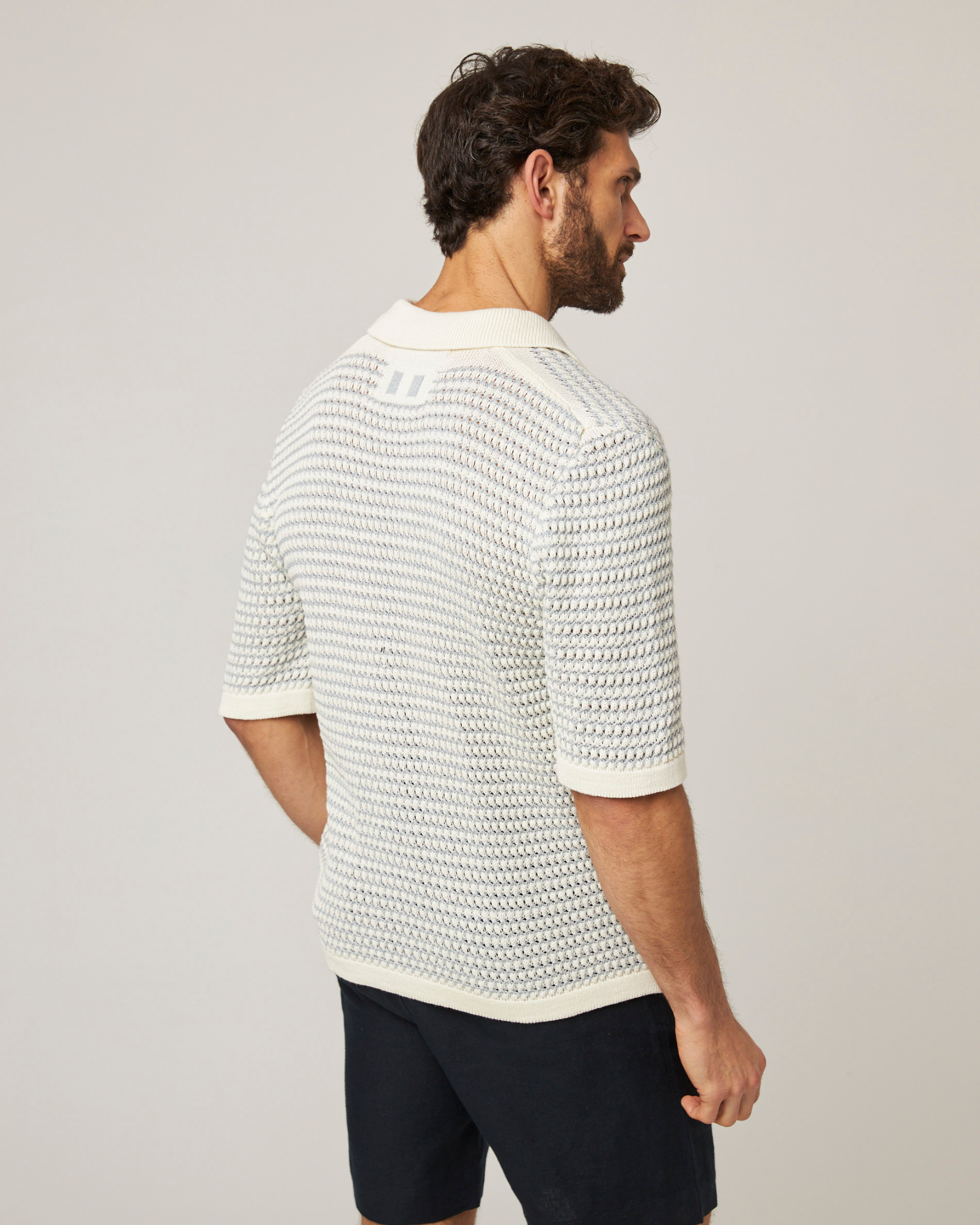 Image of model wearing Island Crochet Shirt. 