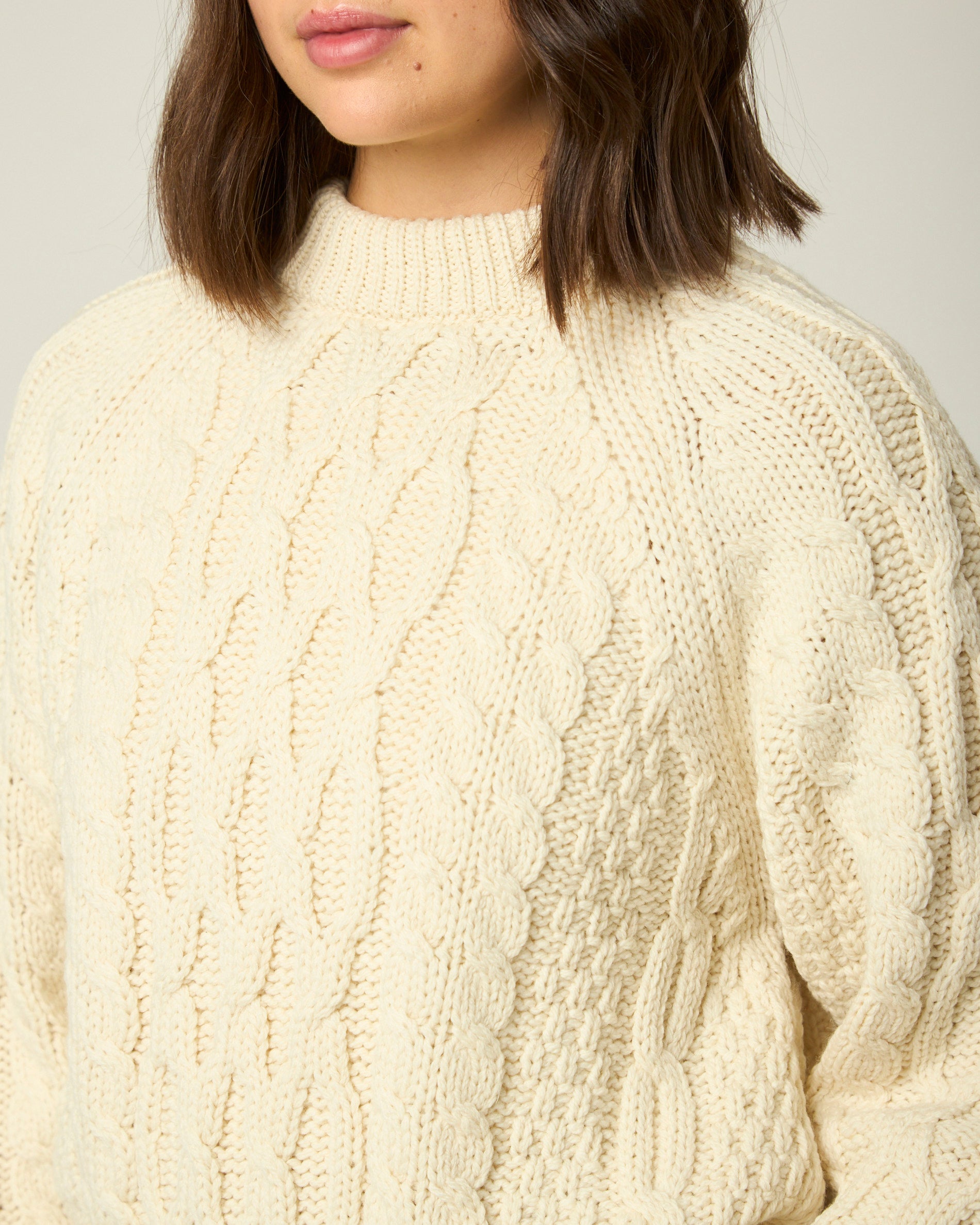 Image of model wearing Isobel Aran Jumper. Model is 5ft8, size UK 8 and wearing size Small
