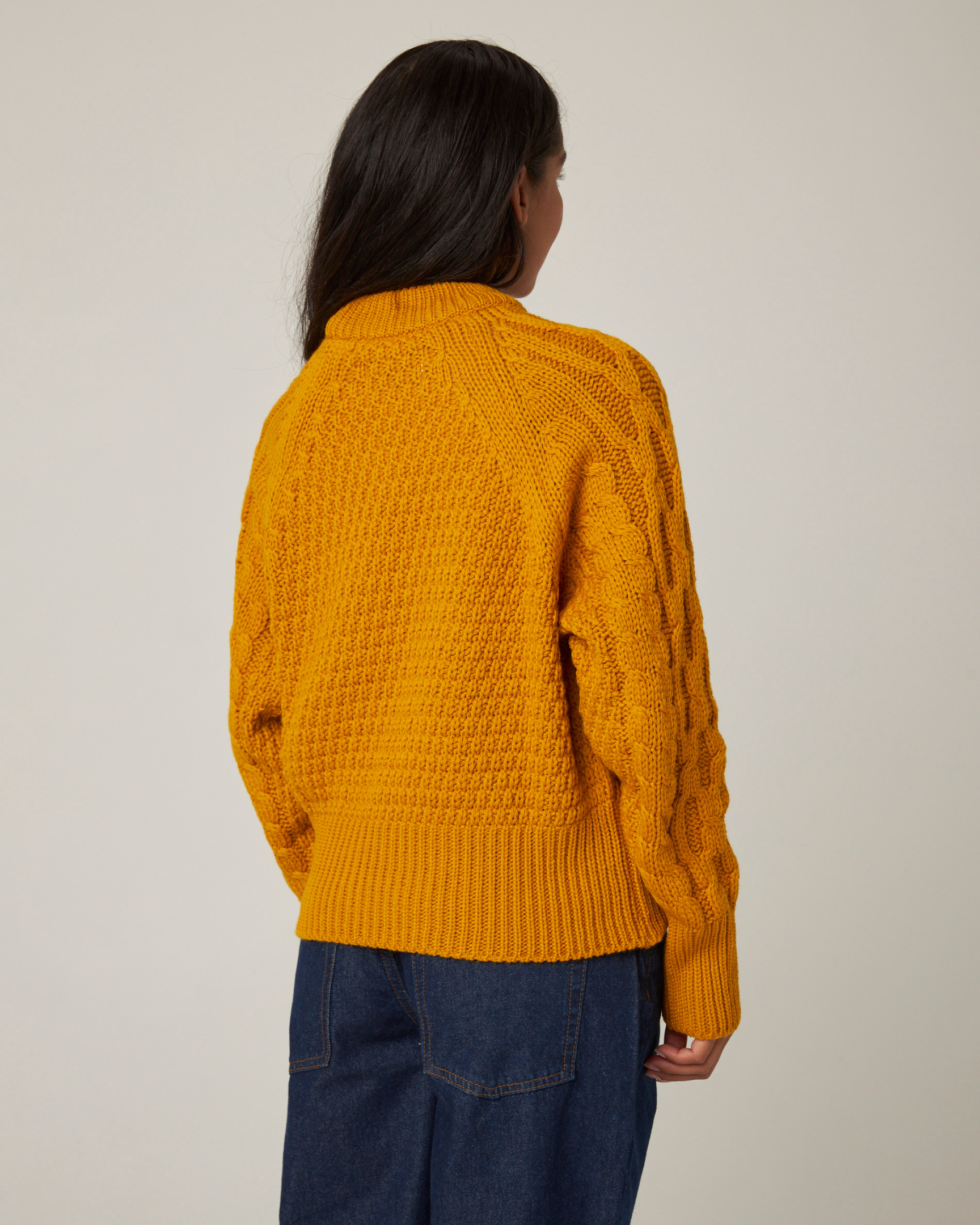 Image of model wearing Isobel Aran Jumper. Model is 5ft8, size UK 8 and wearing size Medium