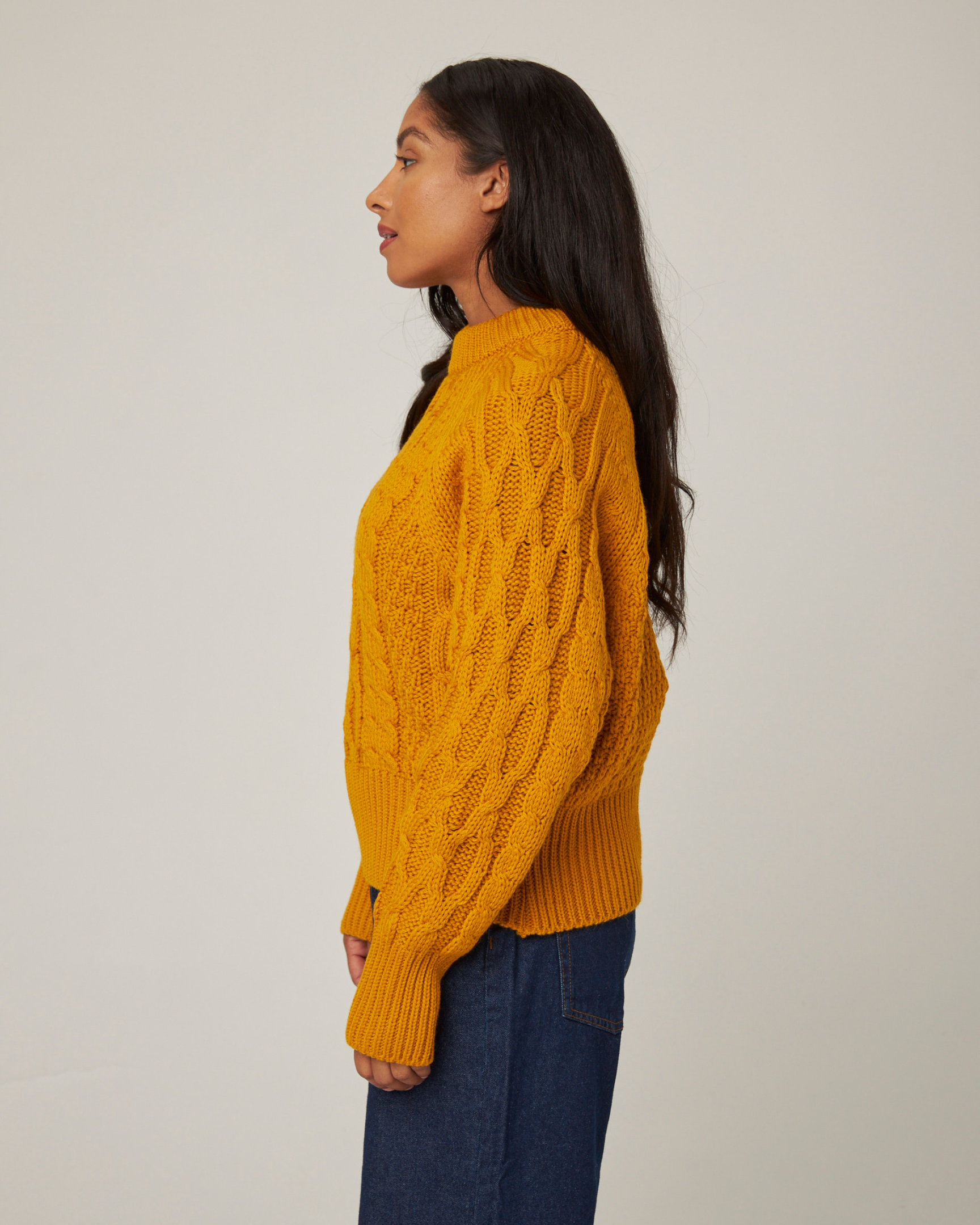 Image of model wearing Isobel Aran Jumper. Model is 5ft8, size UK 8 and wearing size Medium