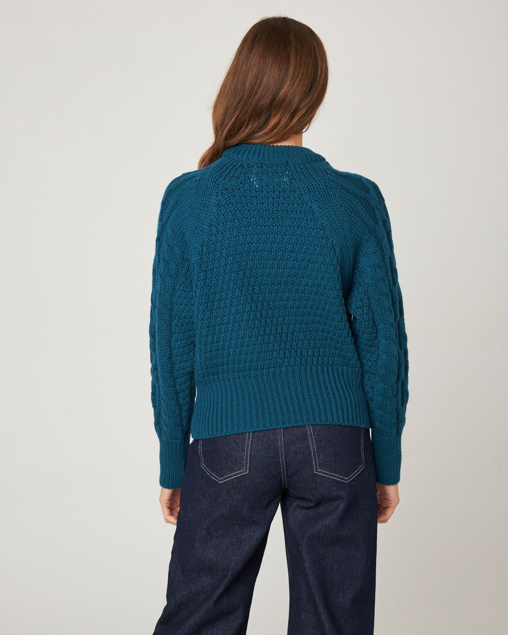 Image of model wearing Isobel Aran Jumper. Model is 5ft8, size UK 8 and wearing size Medium