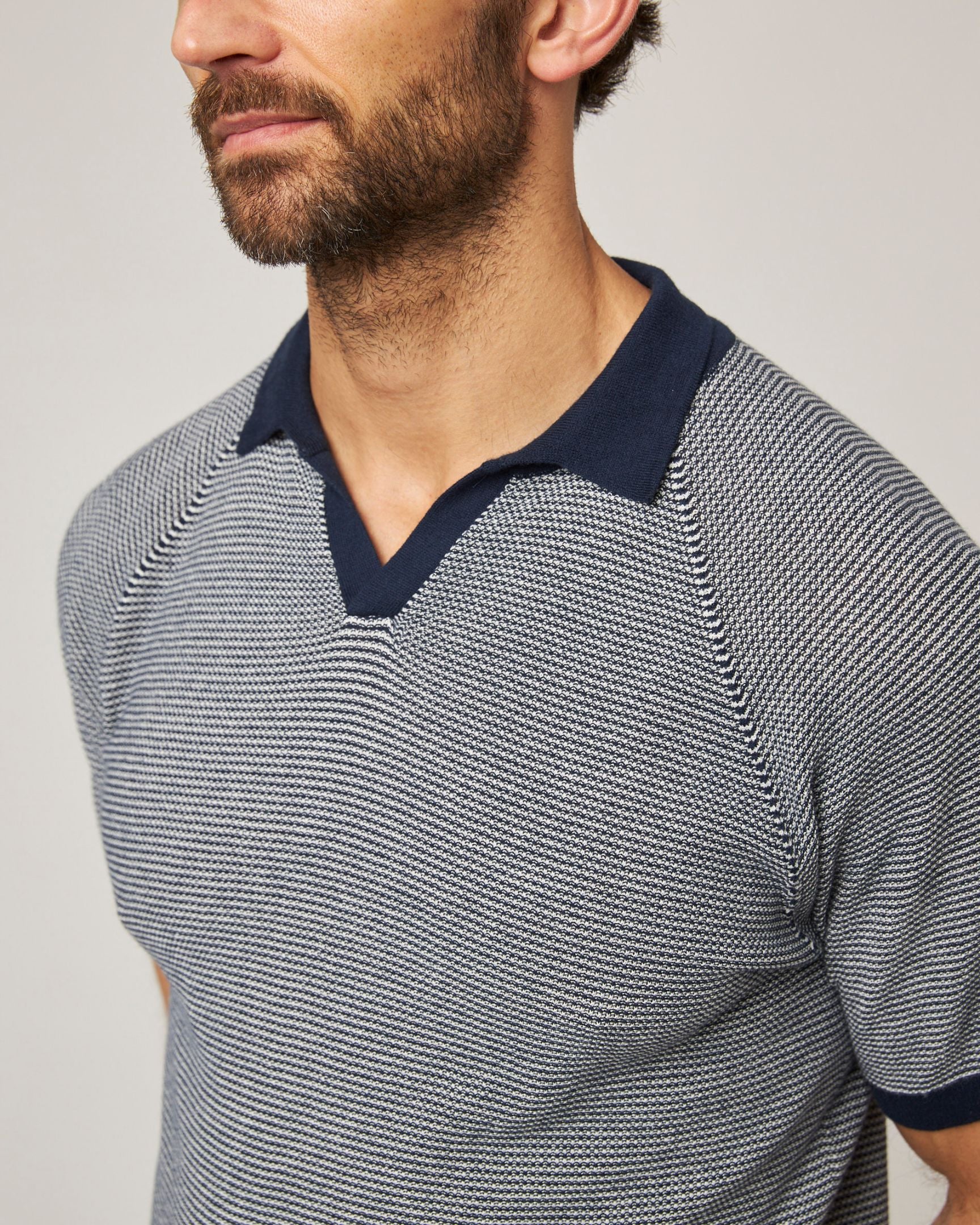 Image of model wearing Lynton Polo Shirt. 