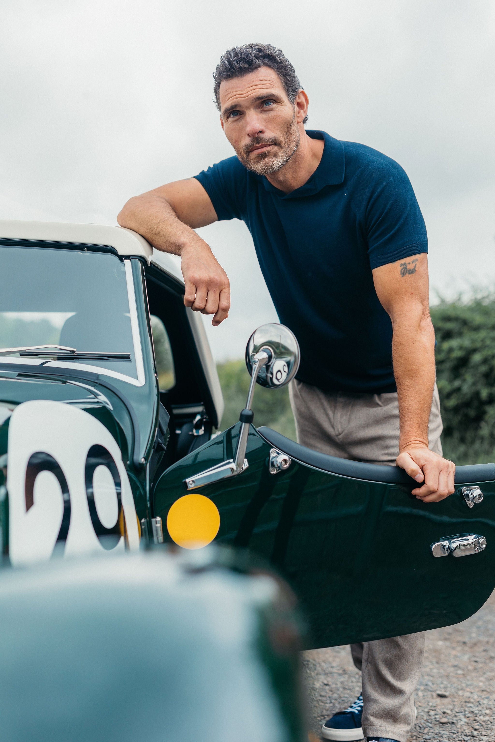 Image of model wearing Knitted Emery Polo Shirt. Model is 6ft, chest size 36in and wearing size Medium