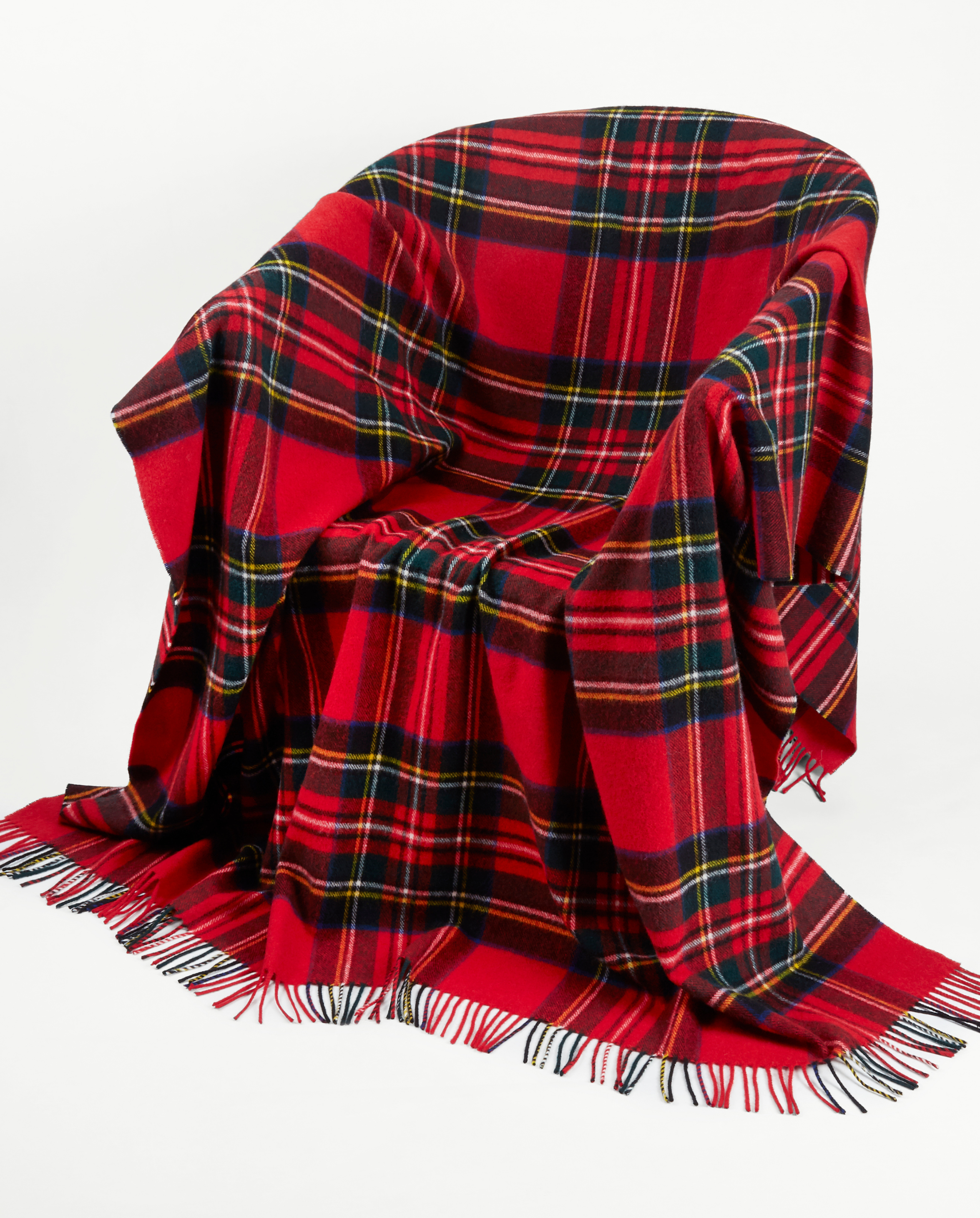 Image of model wearing Wool Blanket. SIZE: 185CM X 140CM (INCLUDES FRINGE)