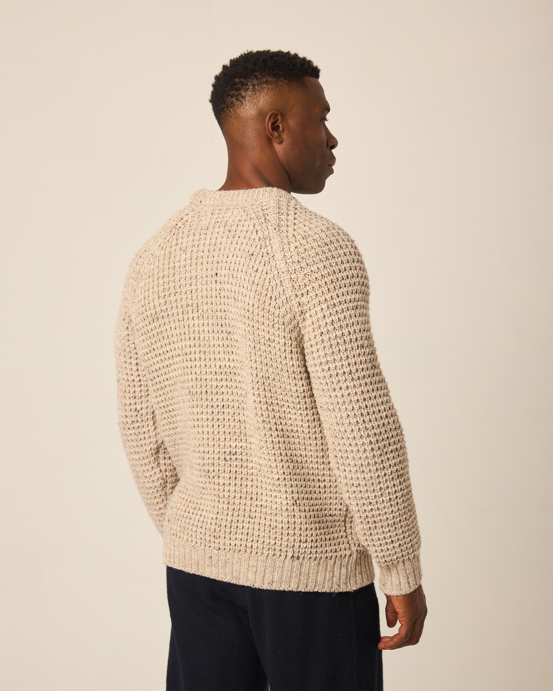 Image of model wearing Waffle Crew Neck Jumper. Model is 6ft1in, chest size 38in and wearing size Medium