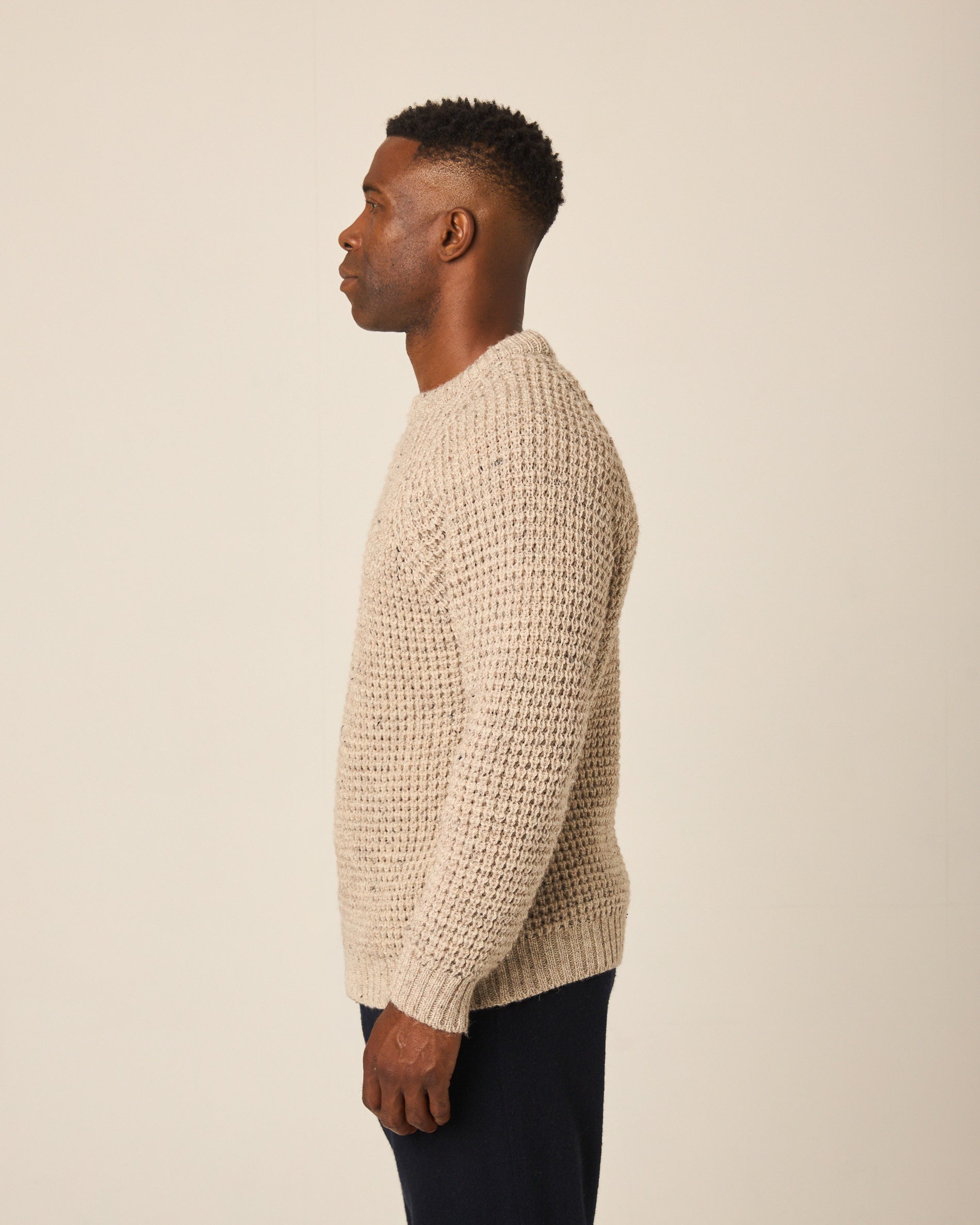 Image of model wearing Waffle Crew Neck Jumper. Model is 6ft1in, chest size 38in and wearing size Medium