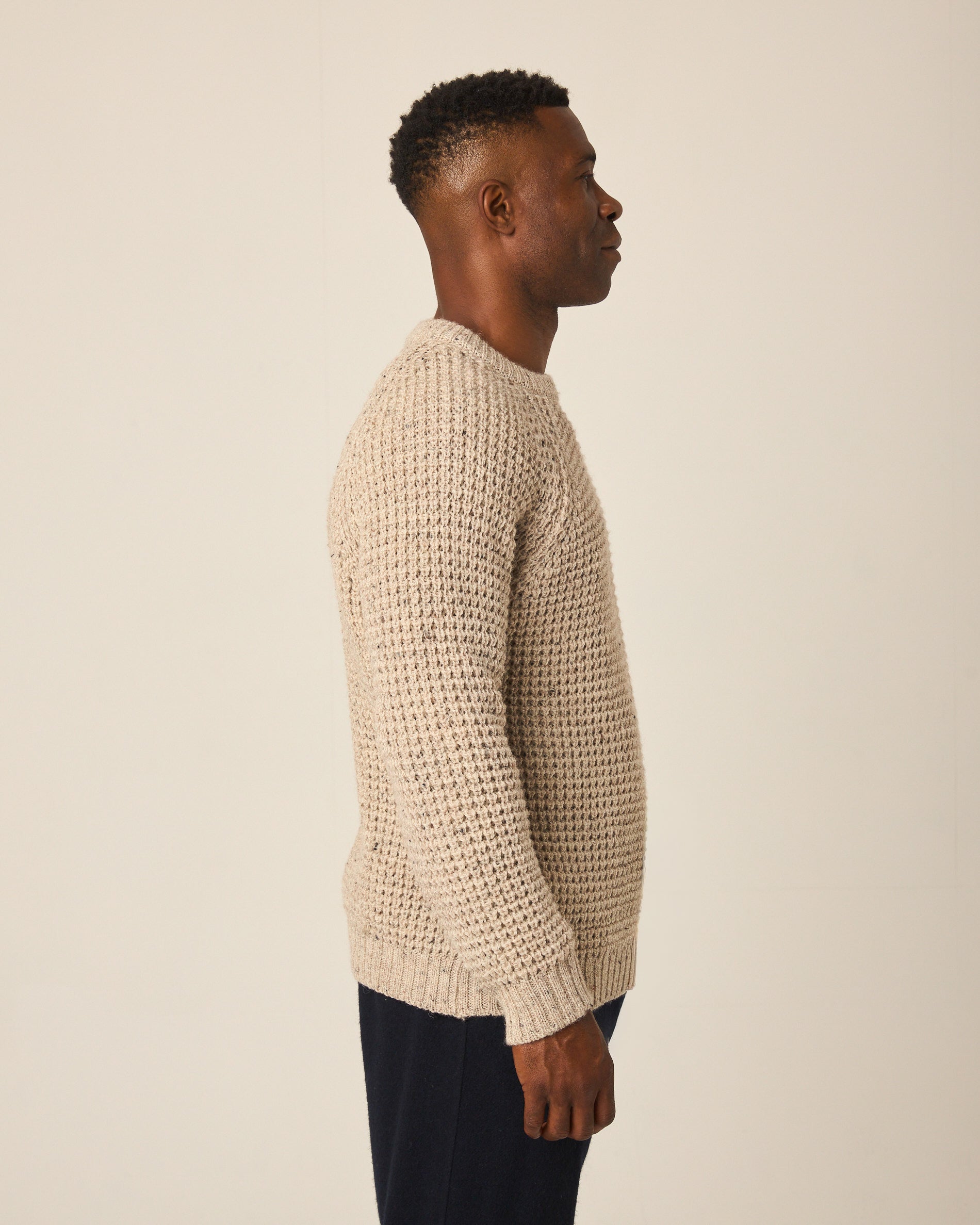 Image of model wearing Waffle Crew Neck Jumper. Model is 6ft1in, chest size 38in and wearing size Medium