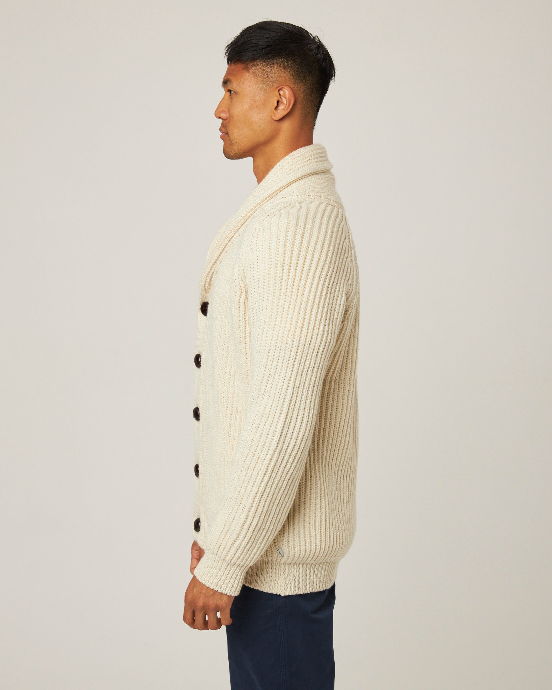 Image of model wearing Wilkinson Cardigan. Model is 6ft1in, chest size 38in and wearing size Large
