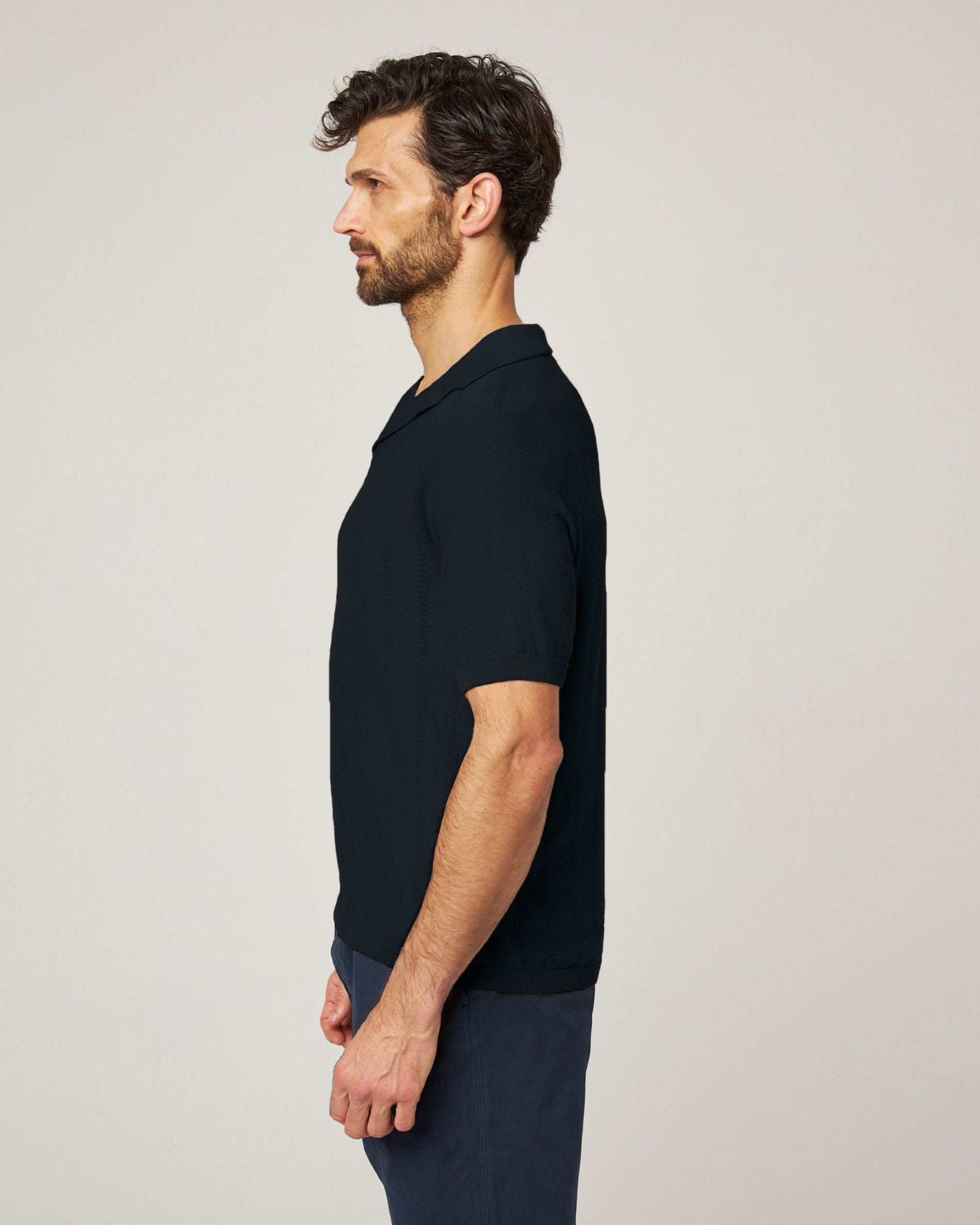 Image of model wearing Alma Polo shirt. 