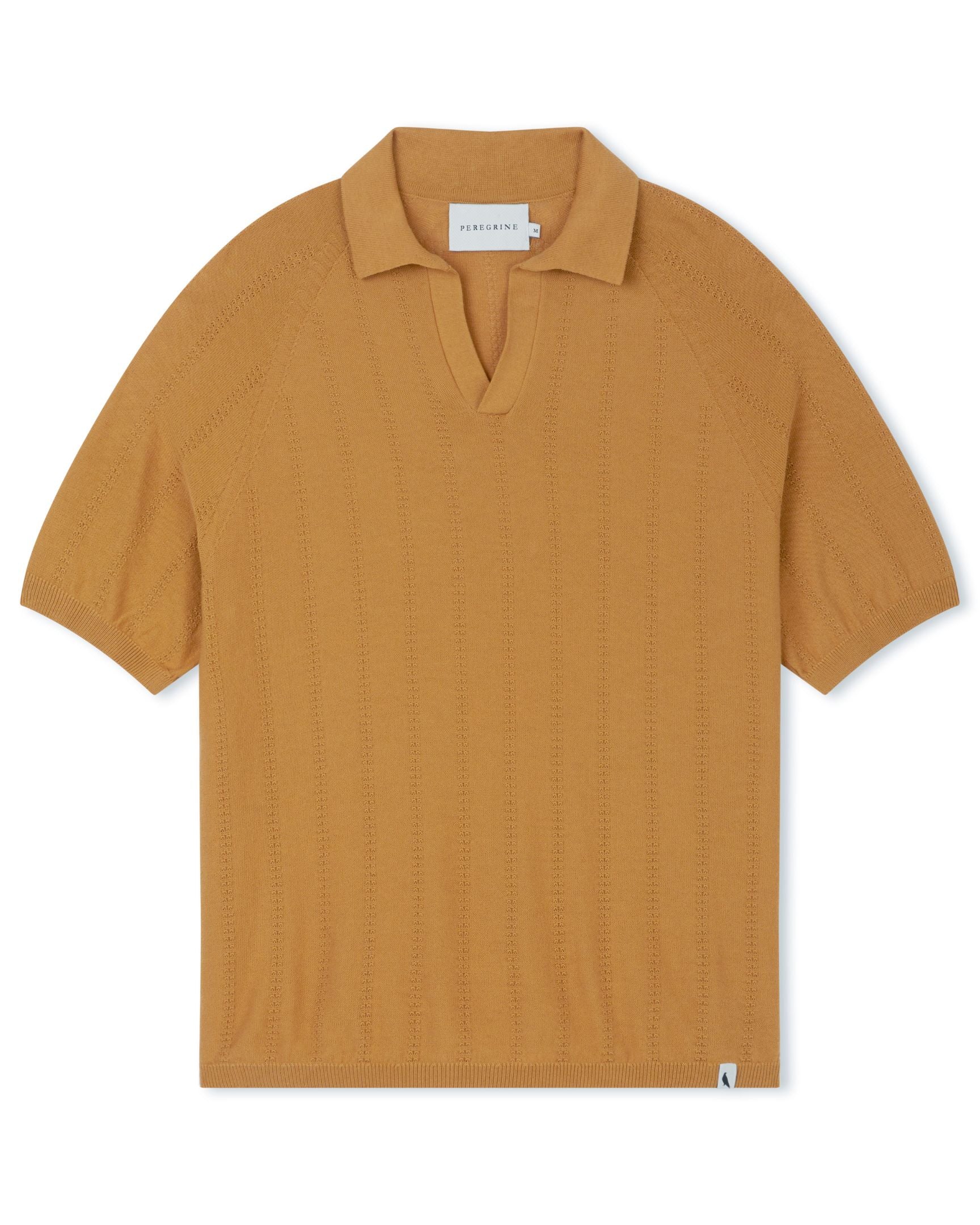 Image of model wearing Alma Polo shirt. 