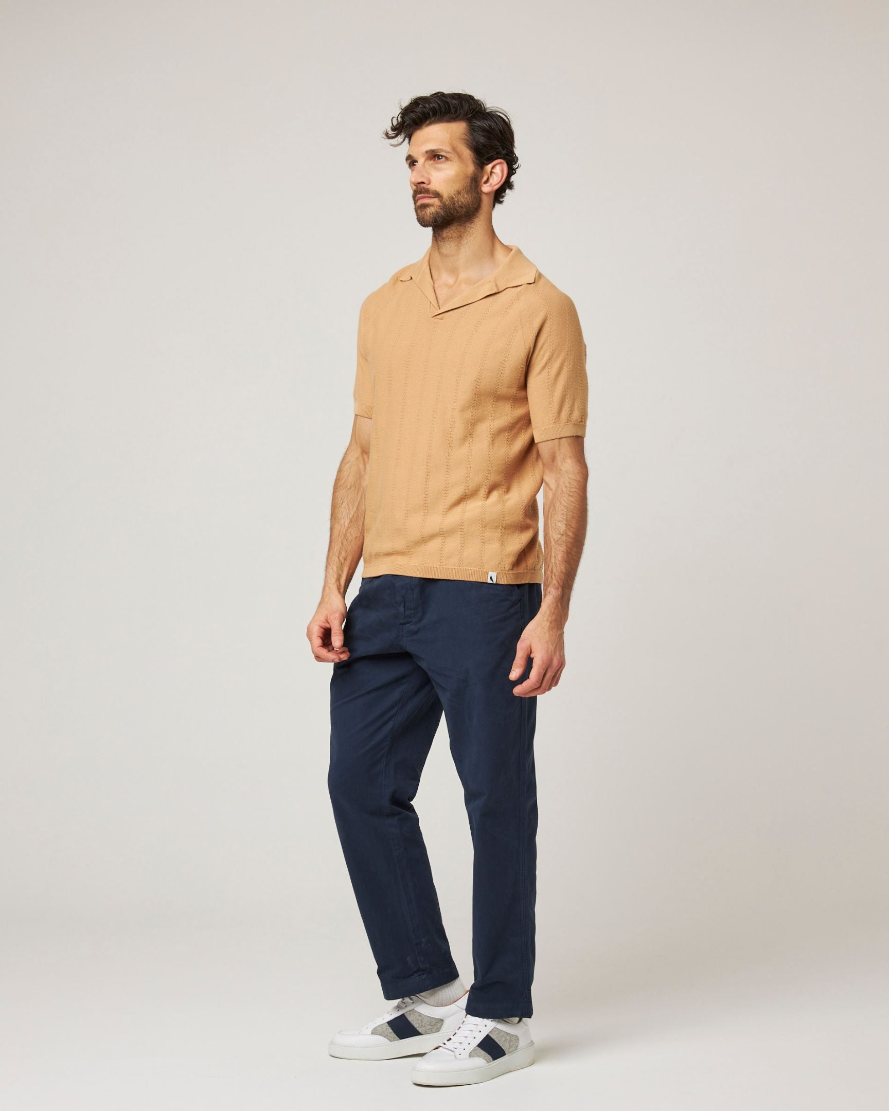 Image of model wearing Alma Polo shirt. 