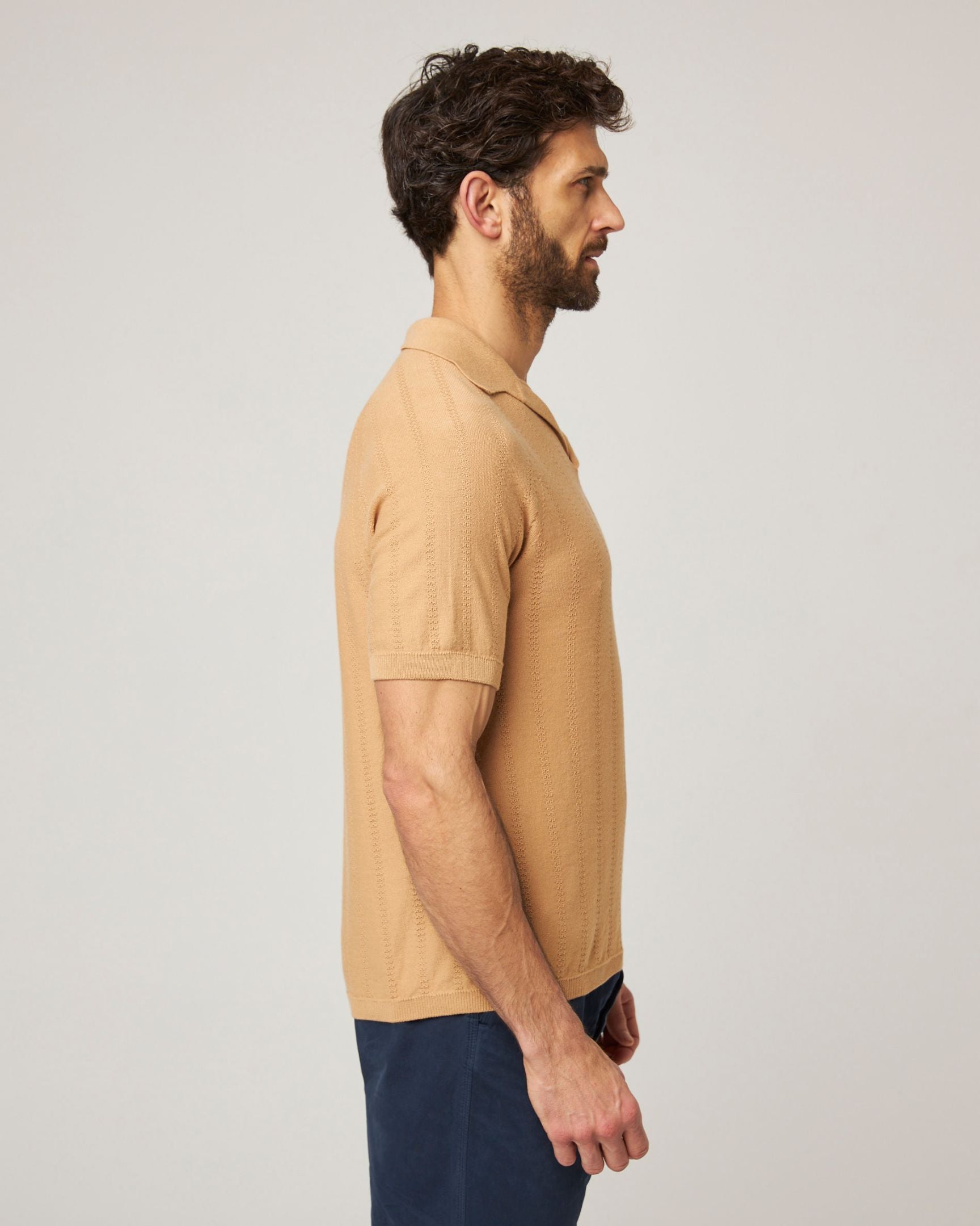 Image of model wearing Alma Polo shirt. 