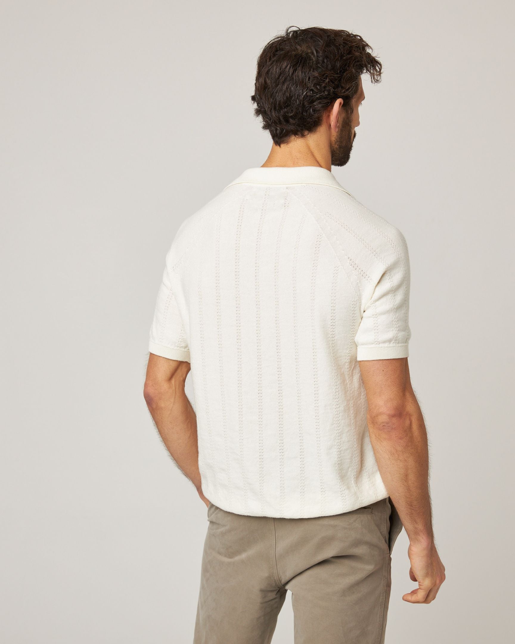 Image of model wearing Alma Polo shirt. 