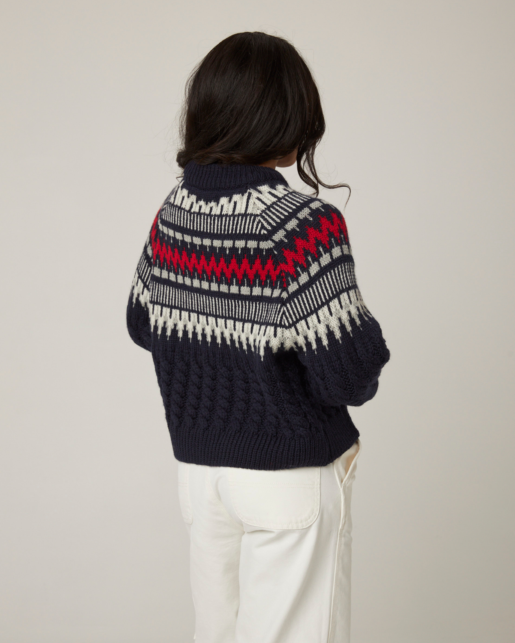 Image of model wearing Alpine Chalet Sweater. 
