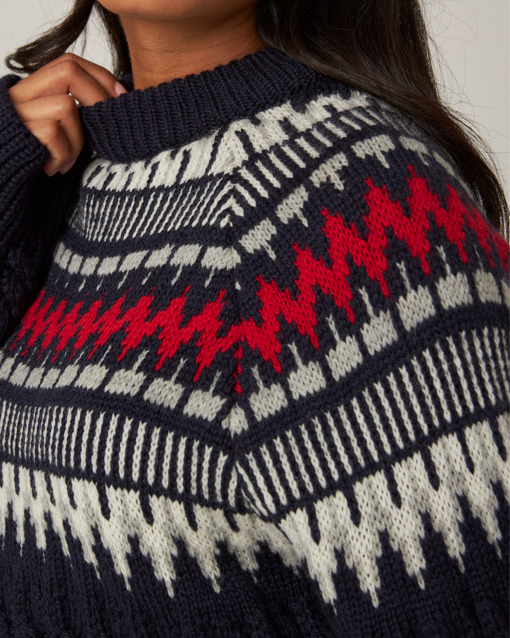 Image of model wearing Alpine Chalet Sweater. 