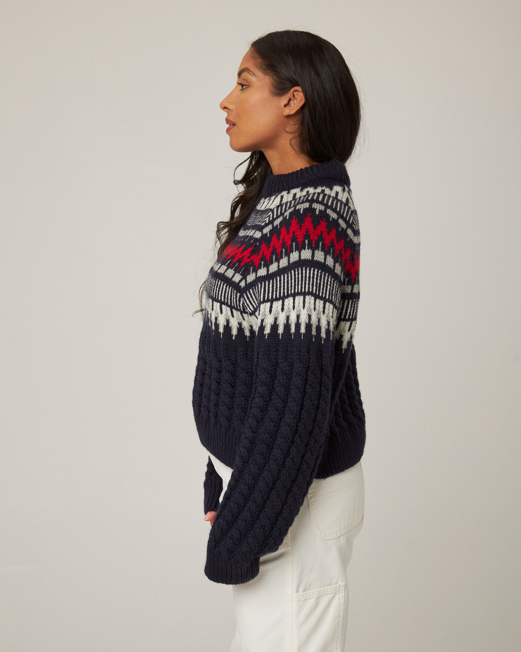 Image of model wearing Alpine Chalet Sweater. 