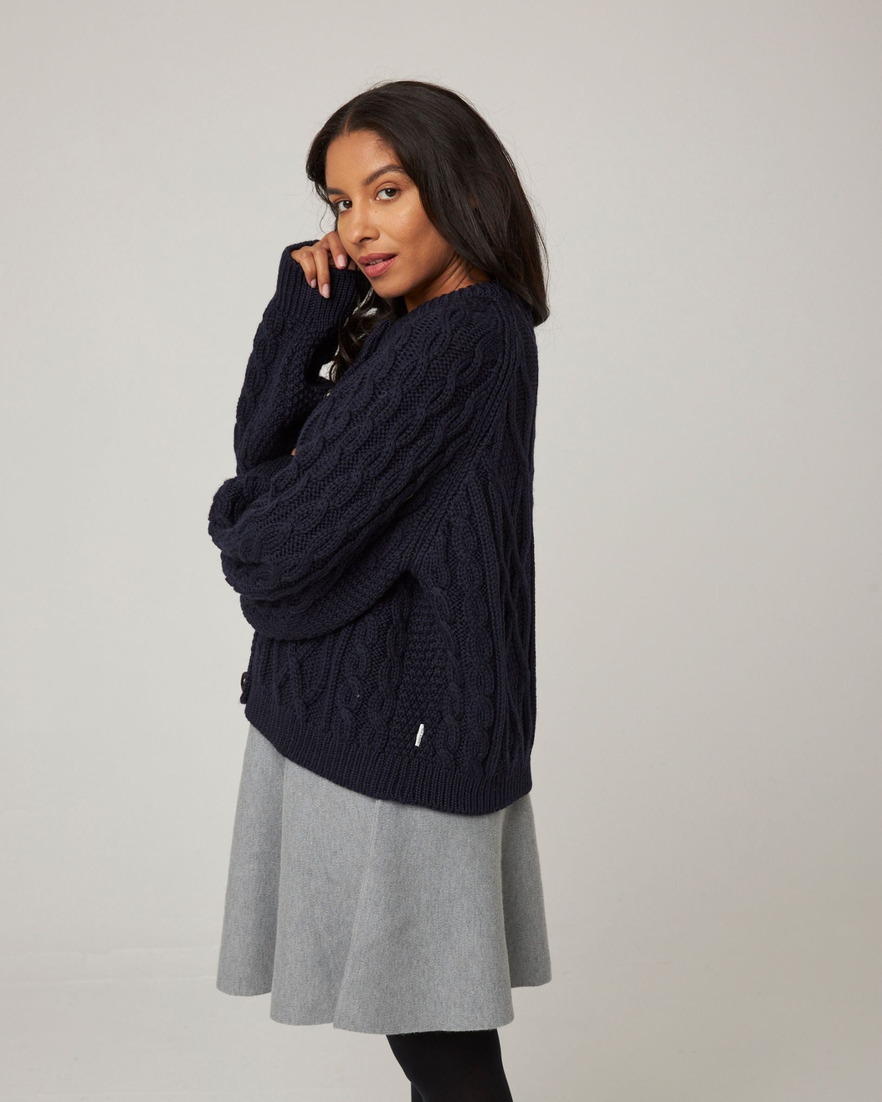 Image of model wearing Beckett Cable Knit Cardigan. 