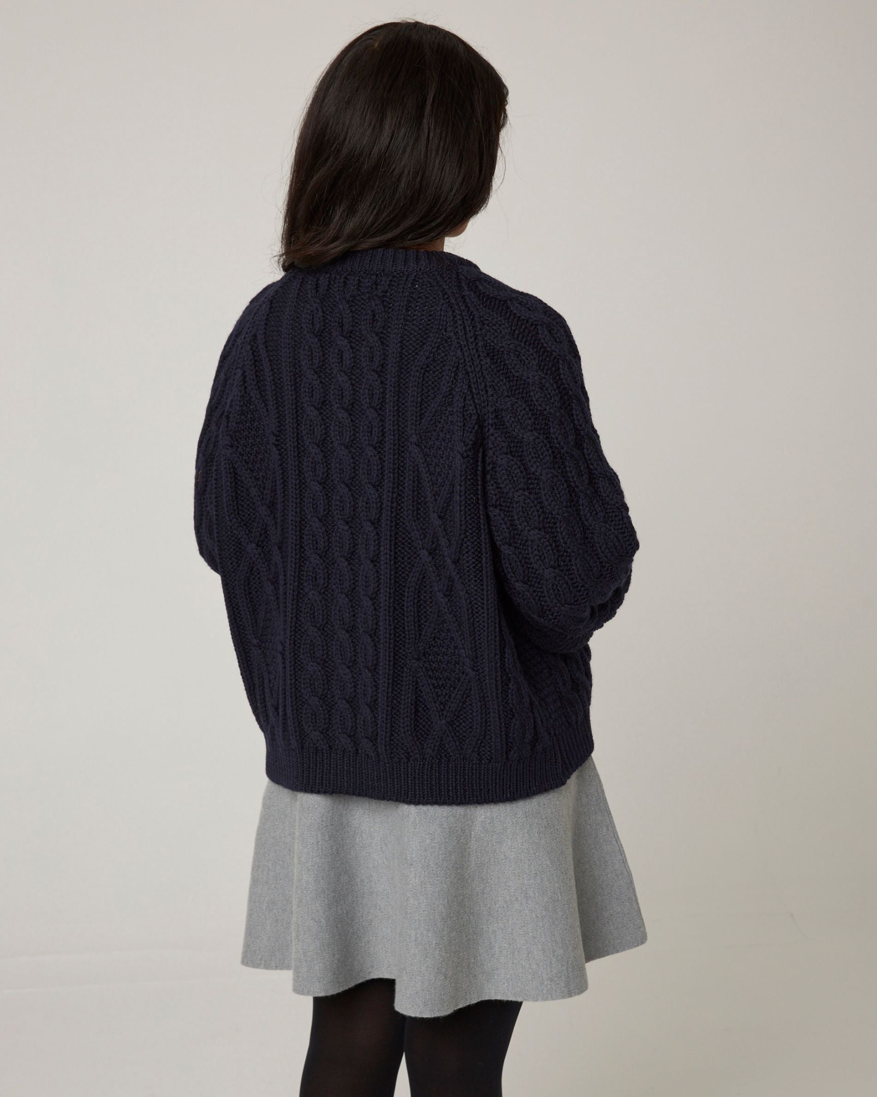 Image of model wearing Beckett Cable Knit Cardigan. 