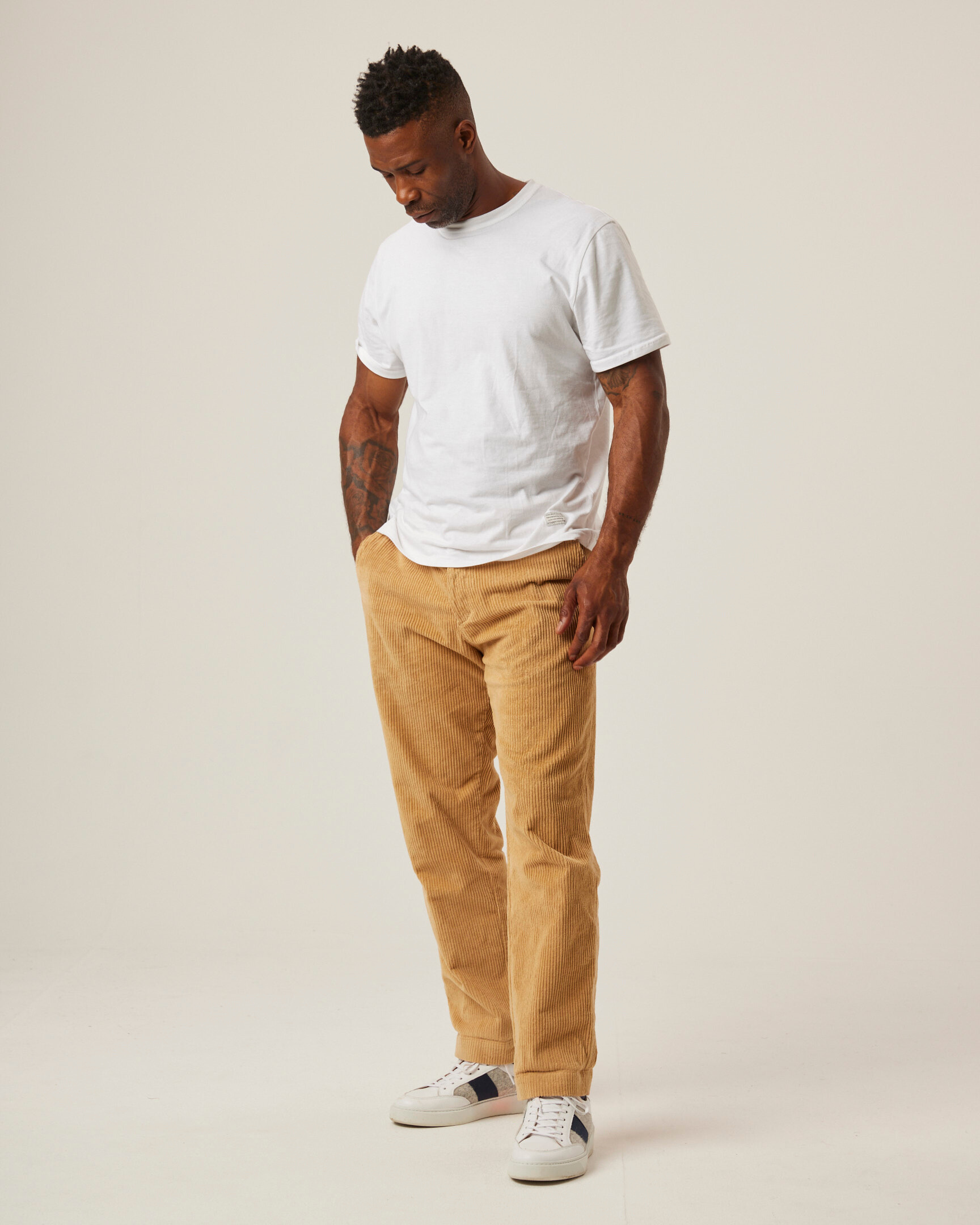 Image of model wearing Blake Corduroy Trousers. 