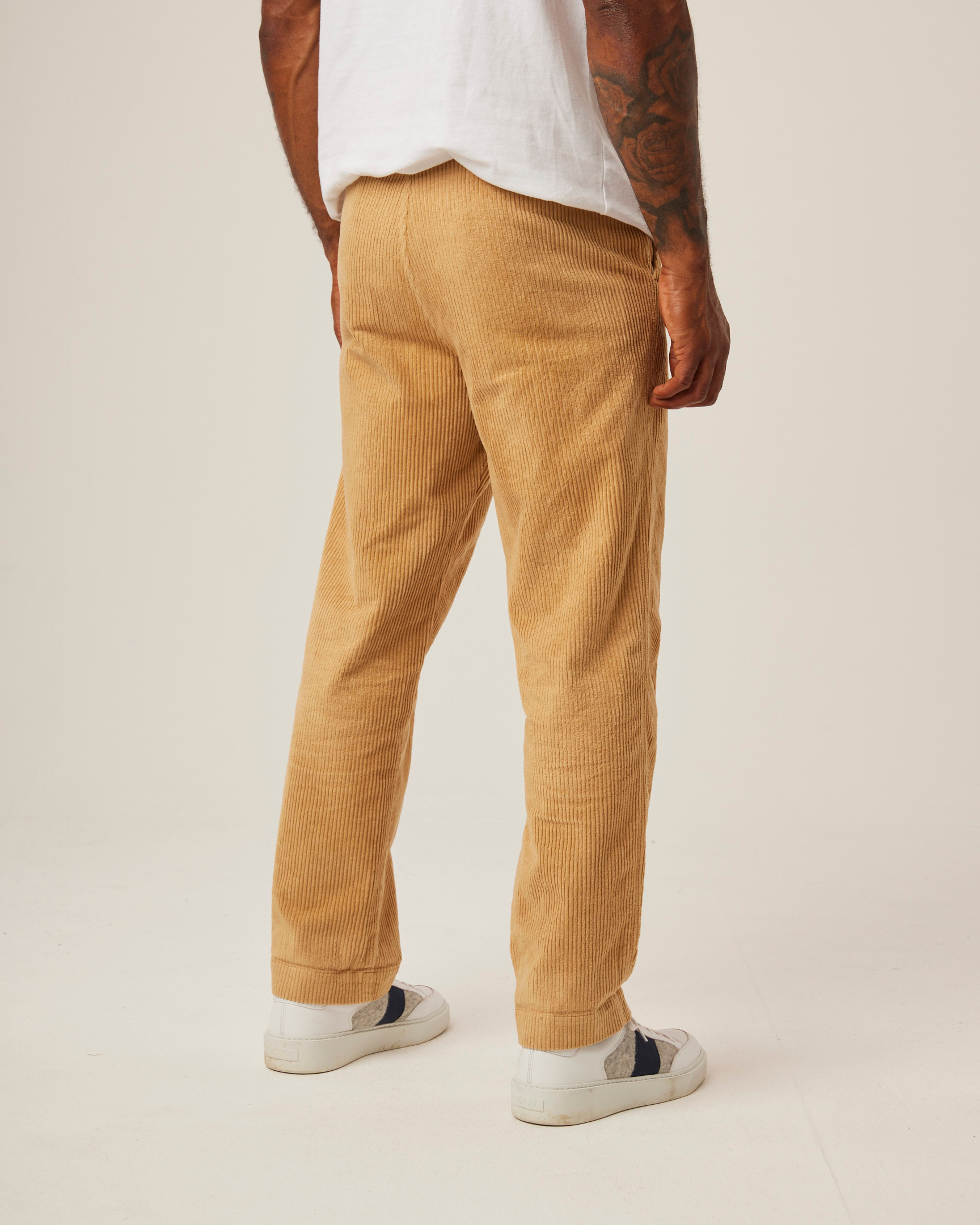 Image of model wearing Blake Corduroy Trousers. 