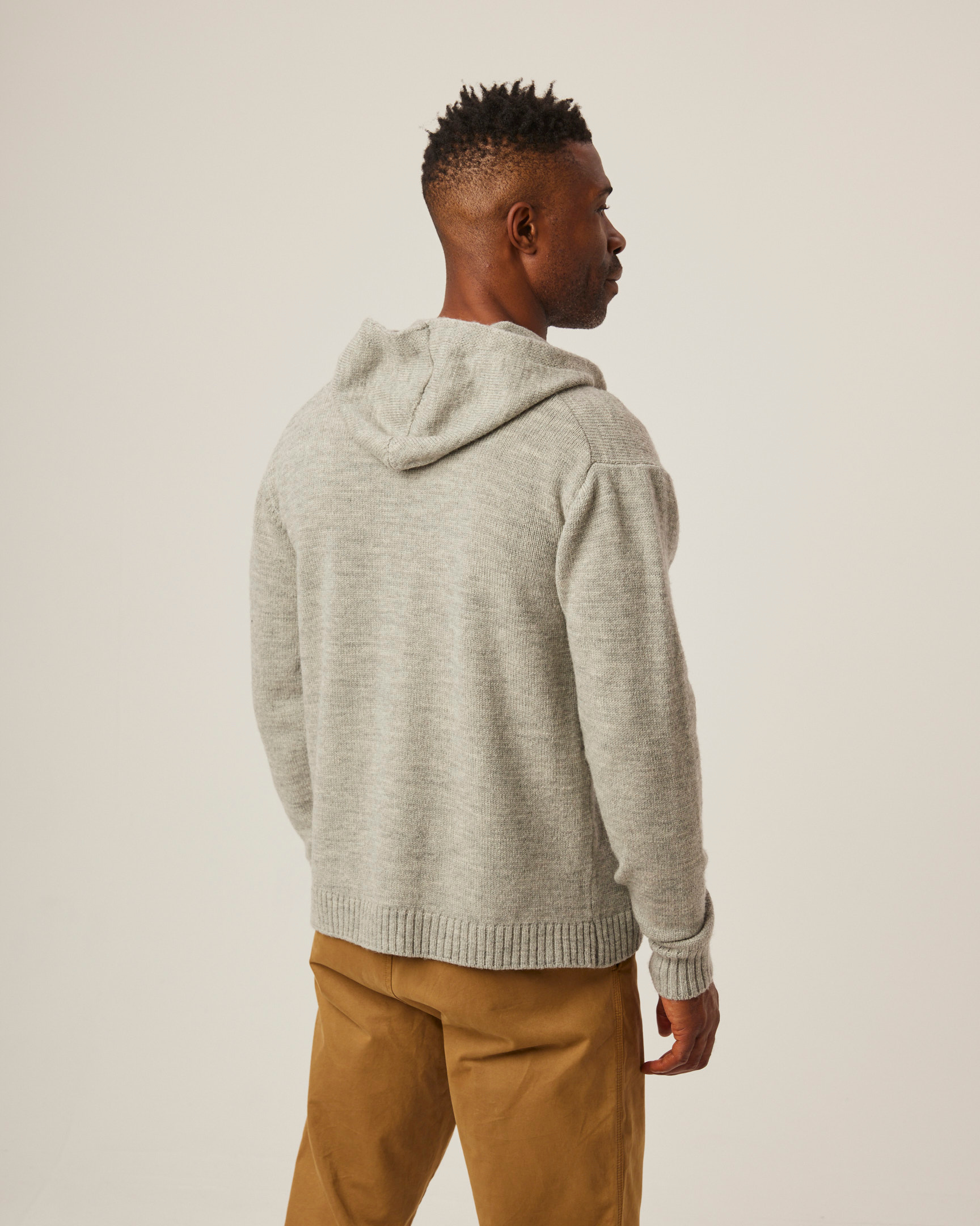 Image of model wearing Brompton Knitted Hoodie. 