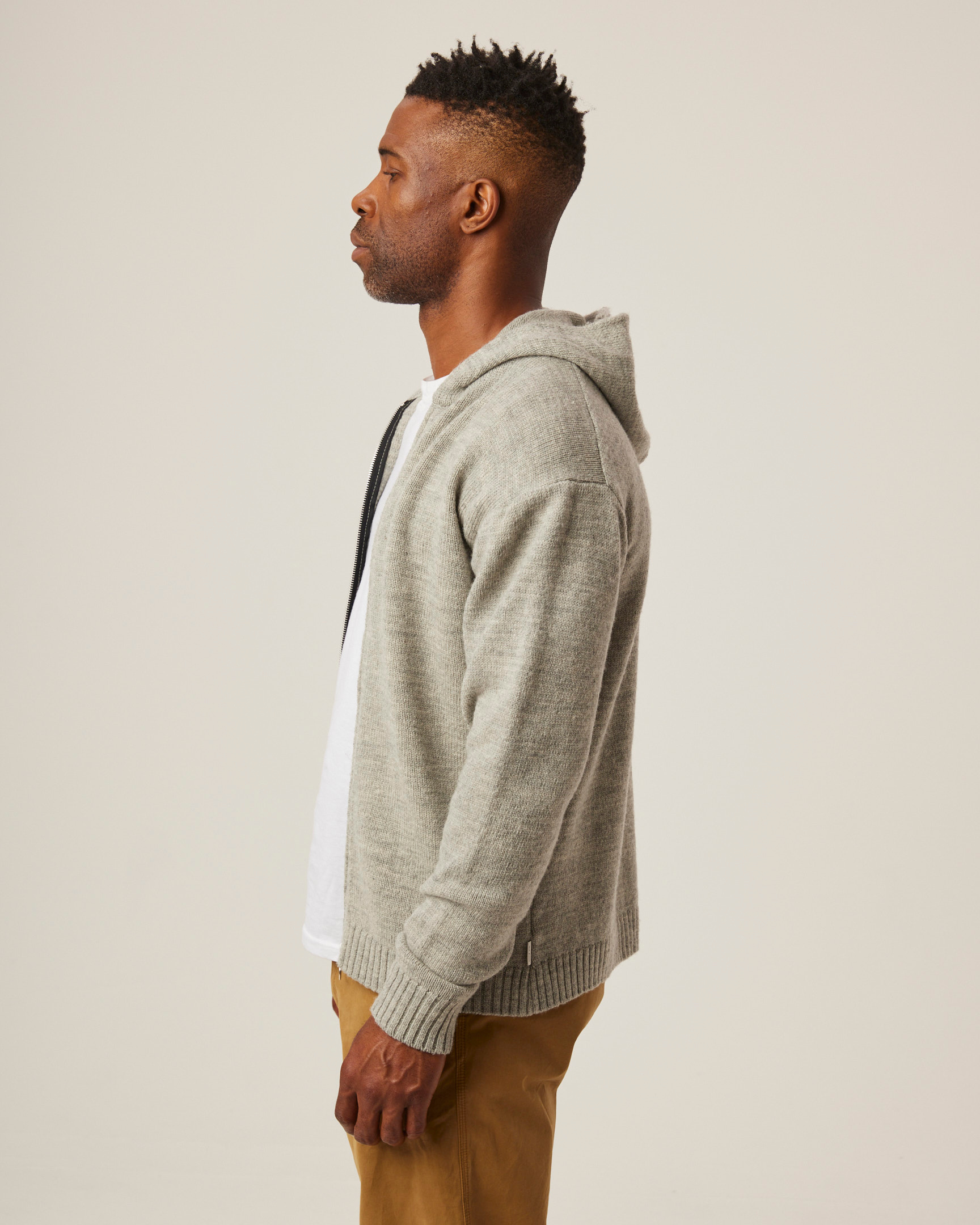 Image of model wearing Brompton Knitted Hoodie. 