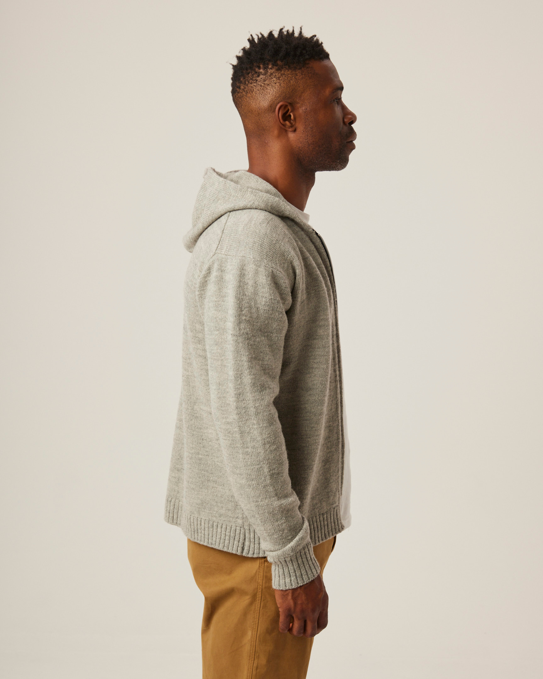 Image of model wearing Brompton Knitted Hoodie. 