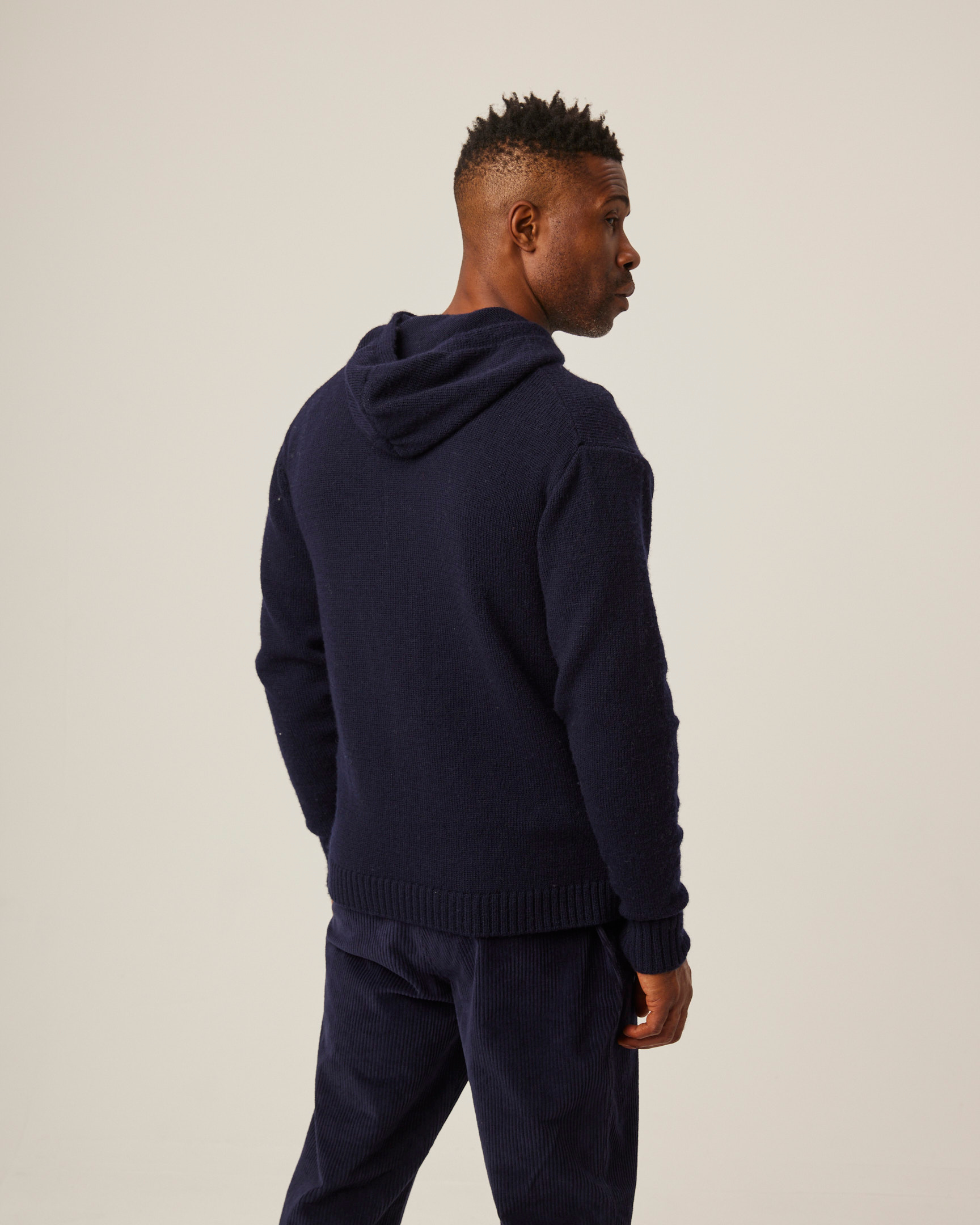 Image of model wearing Brompton Knitted Hoodie. 