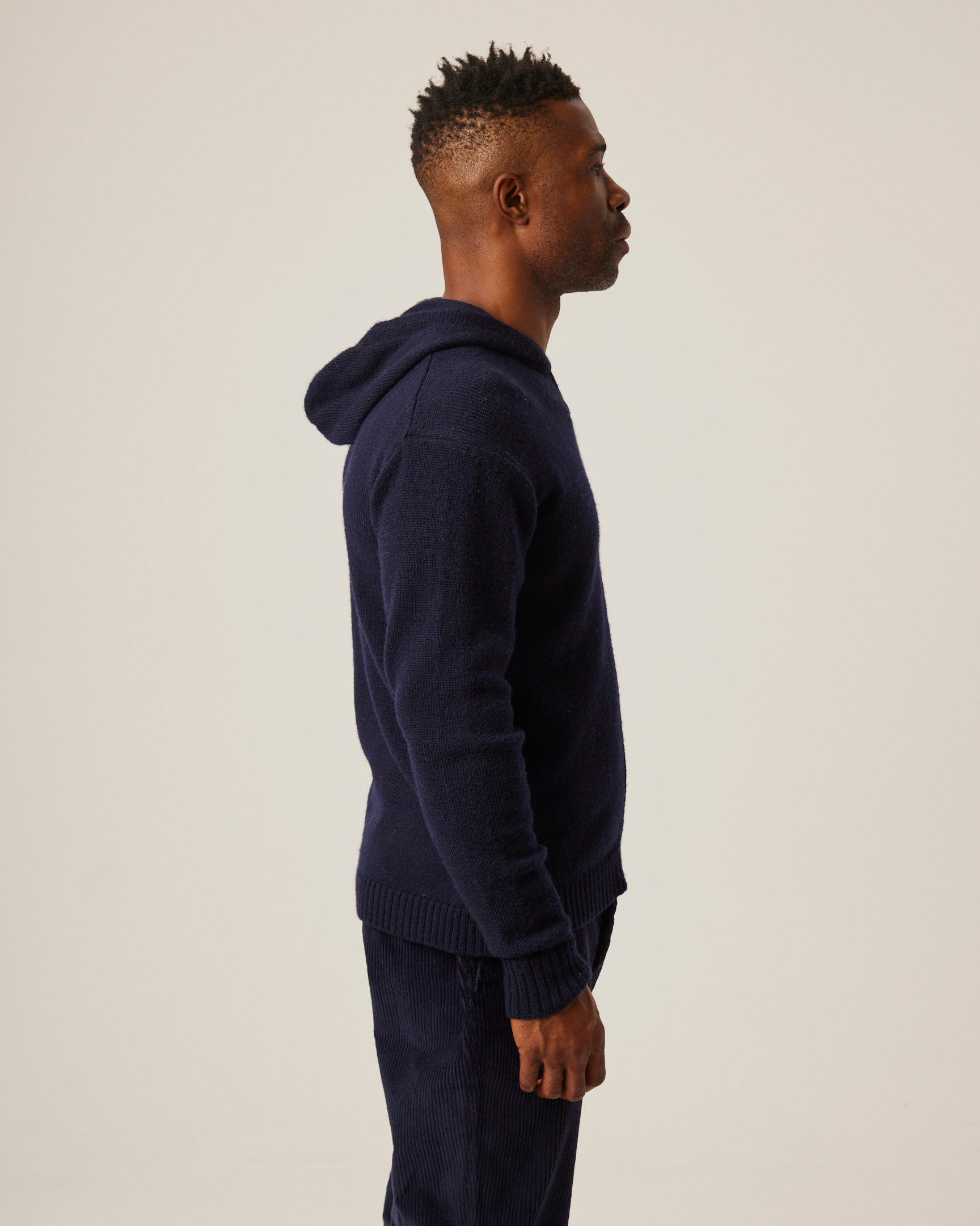 Image of model wearing Brompton Knitted Hoodie. 