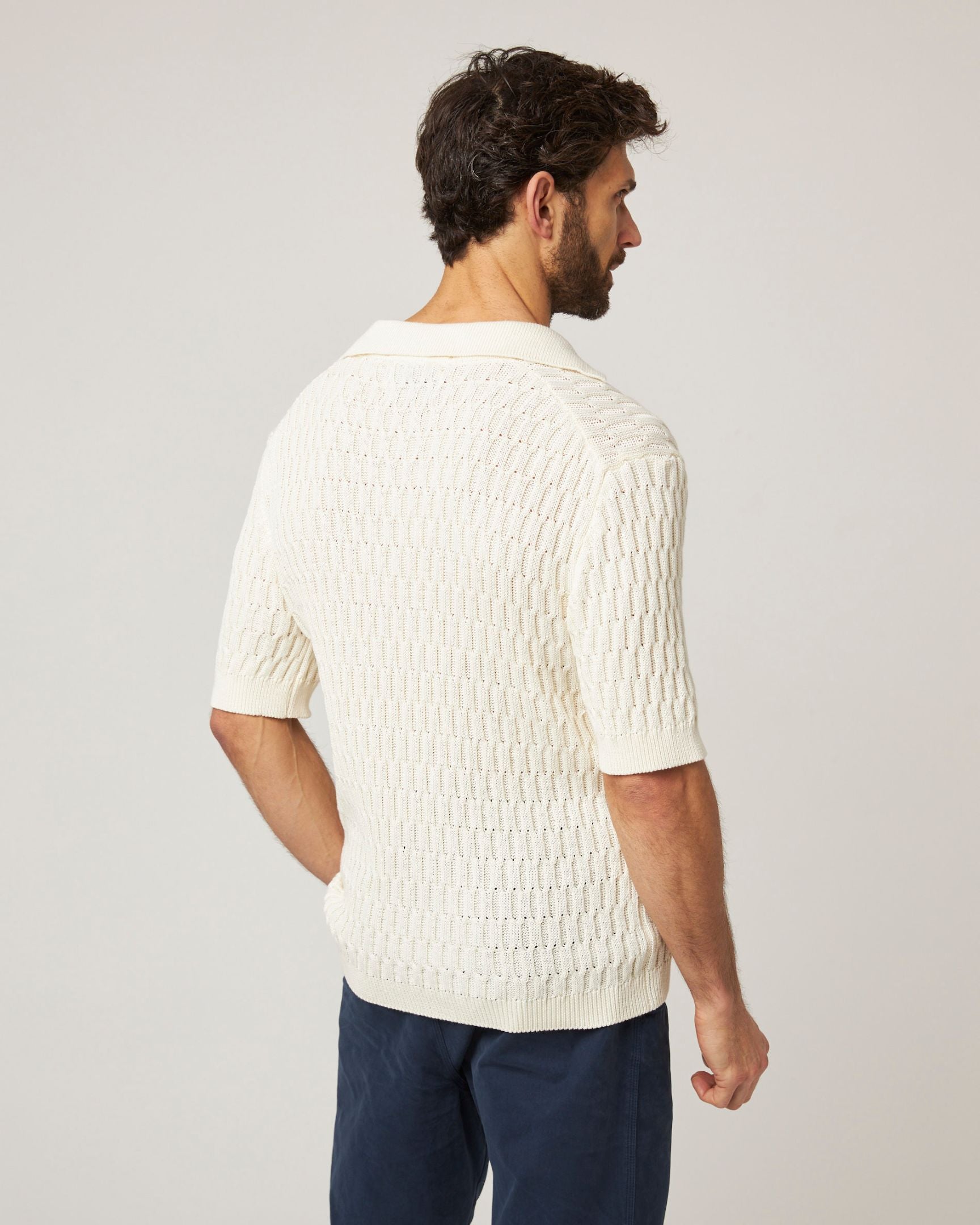 Image of model wearing Cove Polo Shirt. 