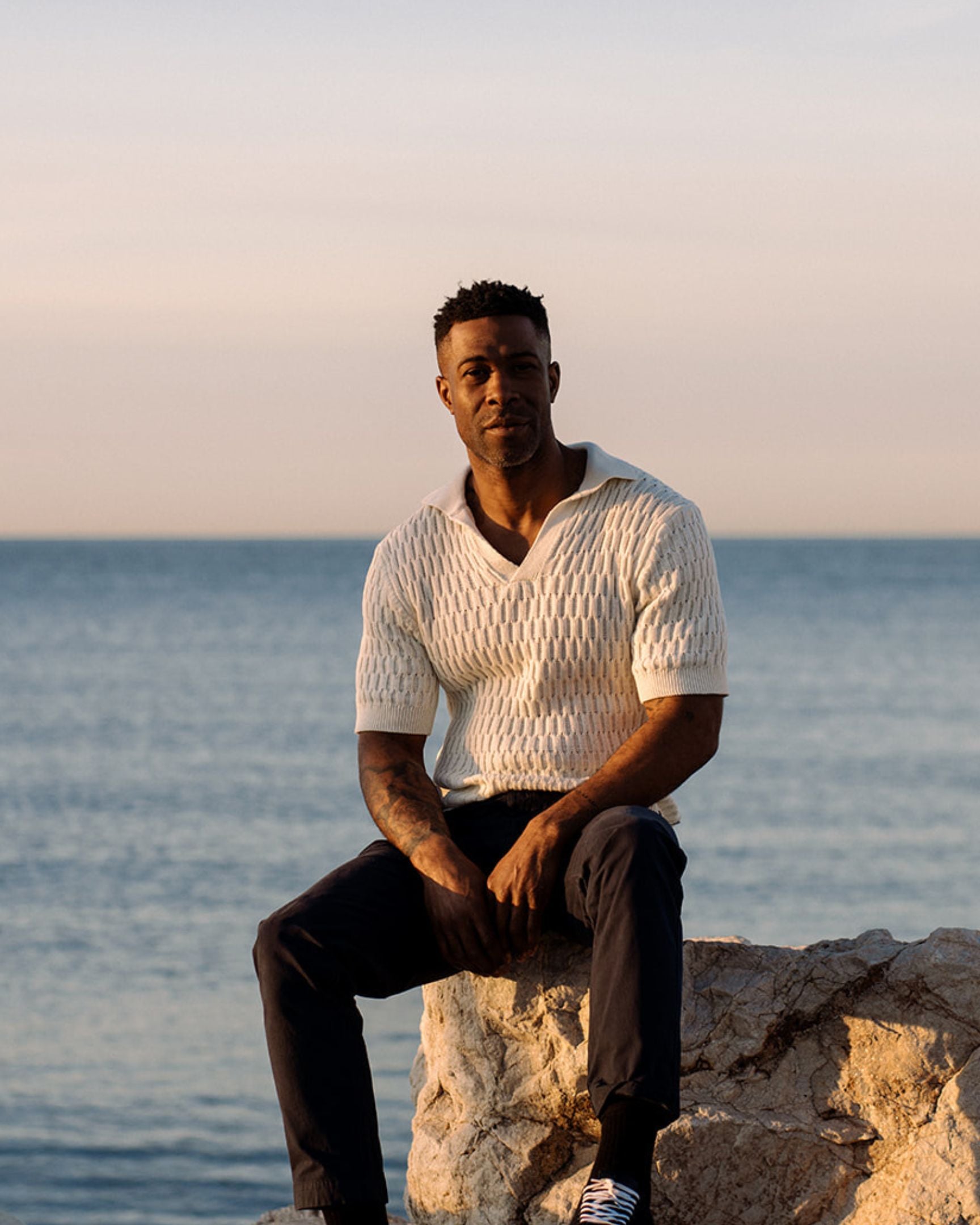 Image of model wearing Cove Polo Shirt. 