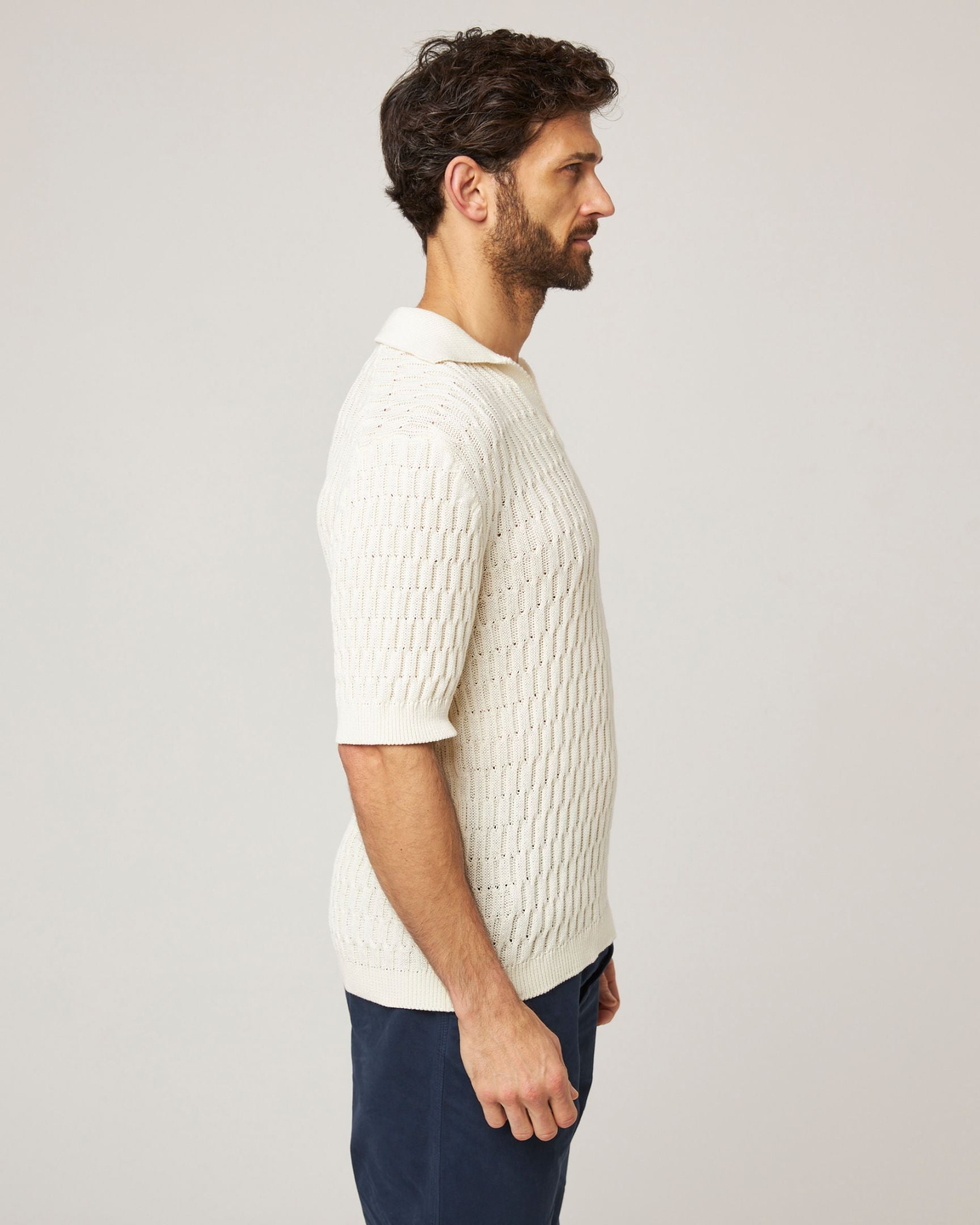 Image of model wearing Cove Polo Shirt. 