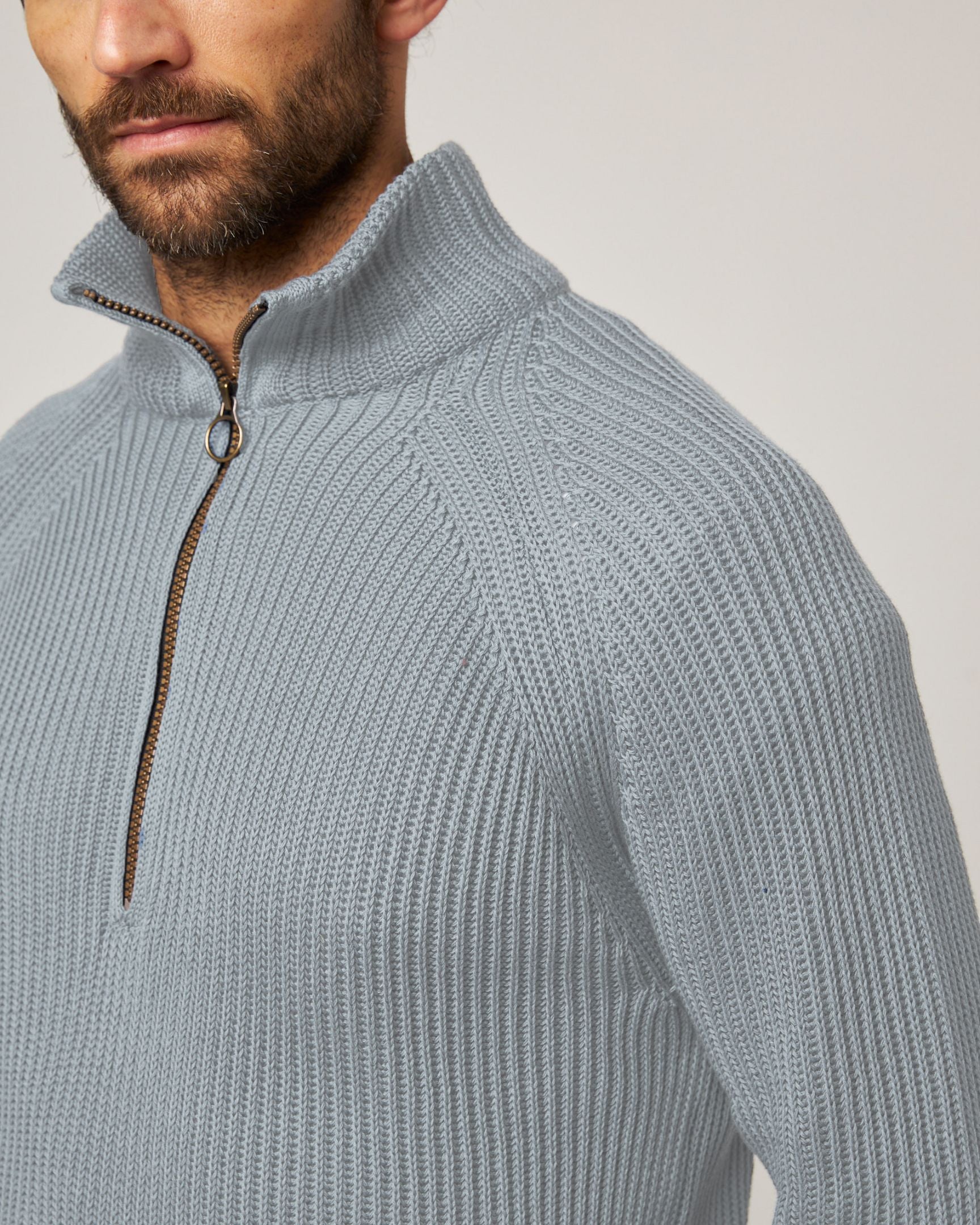Image of model wearing Felix Quarter Zip Jumper. 