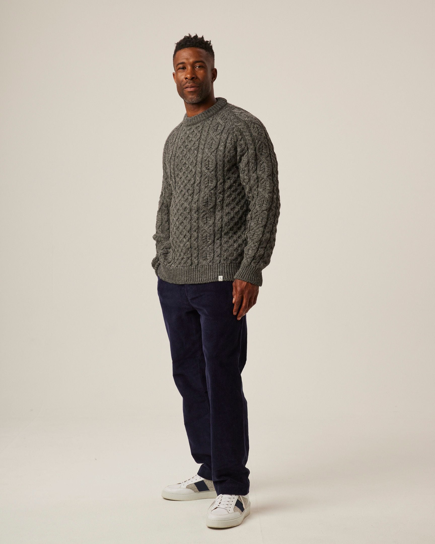 Image of model wearing Hudson Aran Jumper. Model is 6ft1in, chest size 38in and wearing size Medium