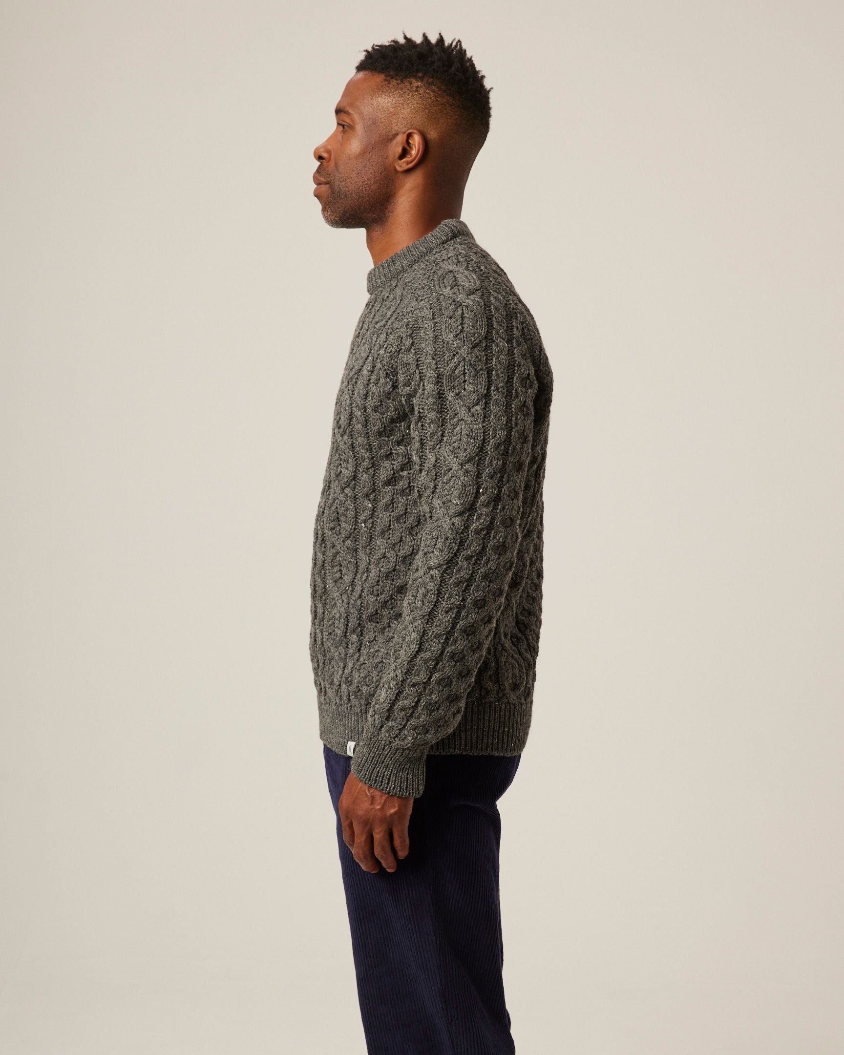 Image of model wearing Hudson Aran Jumper. Model is 6ft1in, chest size 38in and wearing size Medium