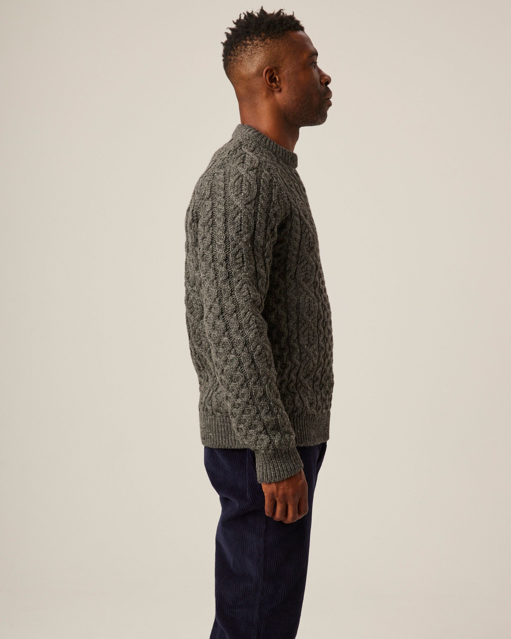 Image of model wearing Hudson Aran Jumper. Model is 6ft1in, chest size 38in and wearing size Medium