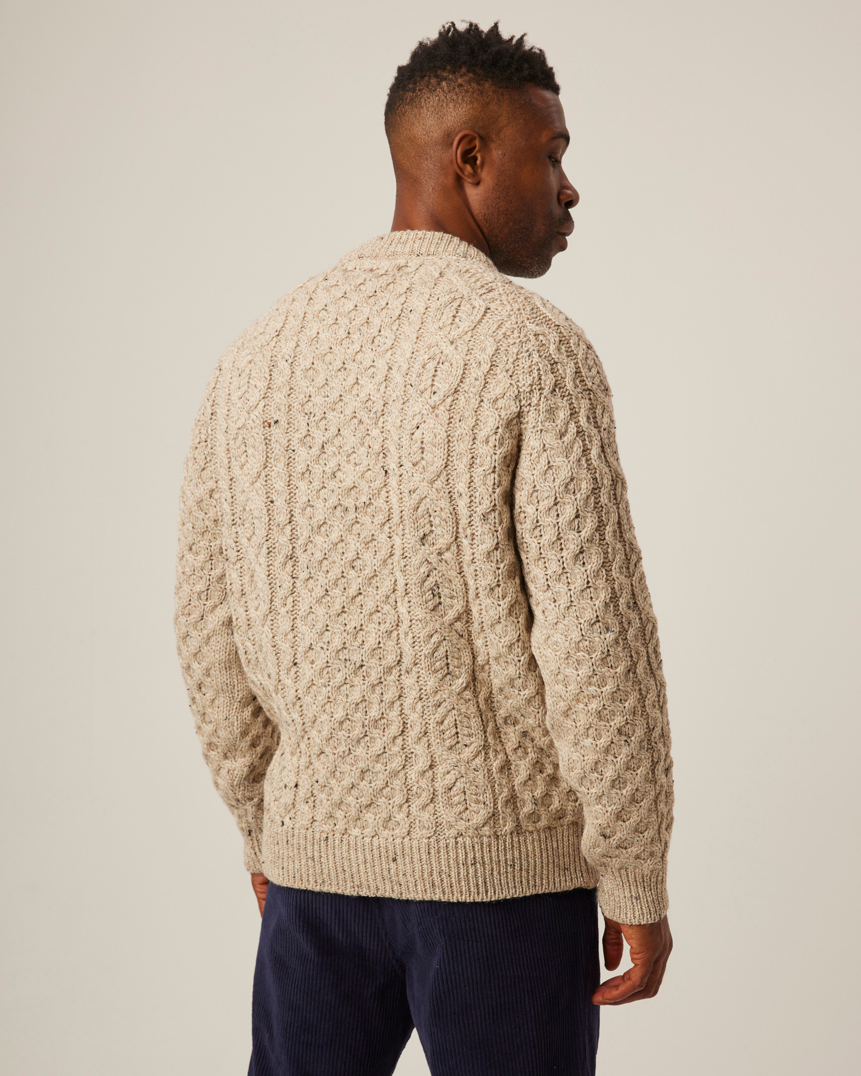 Image of model wearing Hudson Aran Jumper. Model is 6ft, chest size 36in and wearing size Large