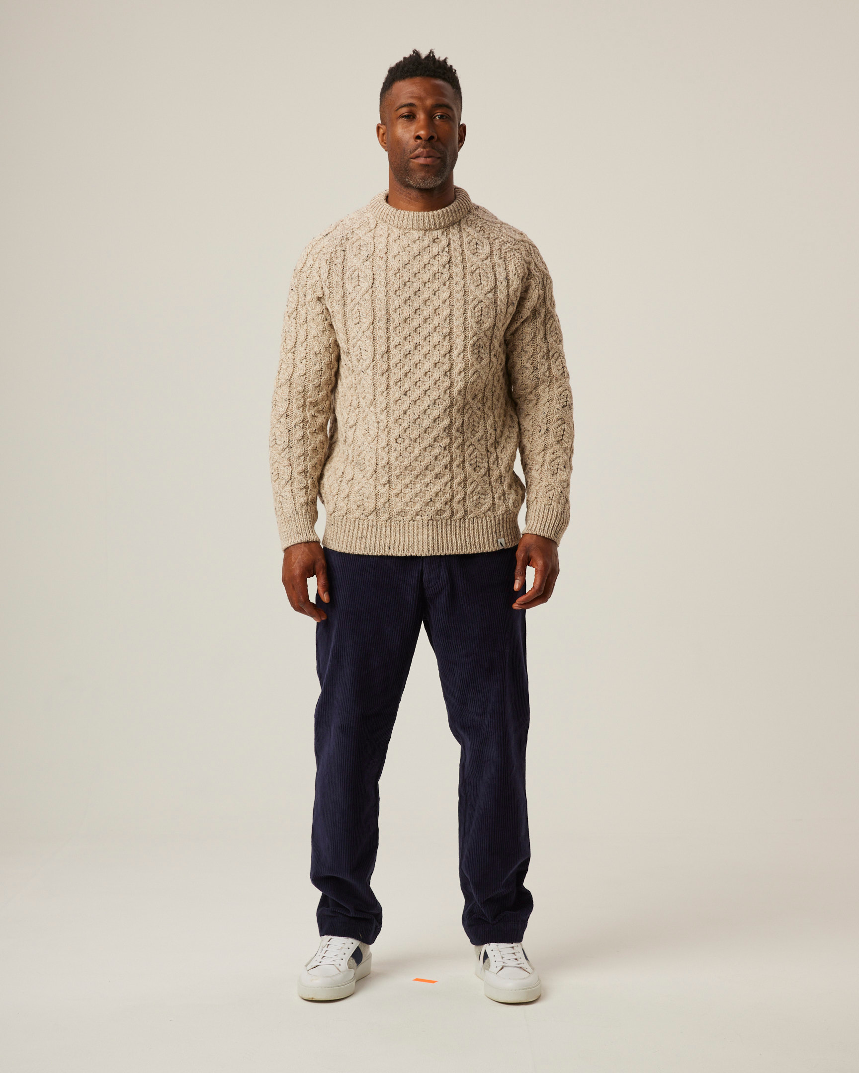 Image of model wearing Hudson Aran Jumper. Model is 6ft, chest size 36in and wearing size Large
