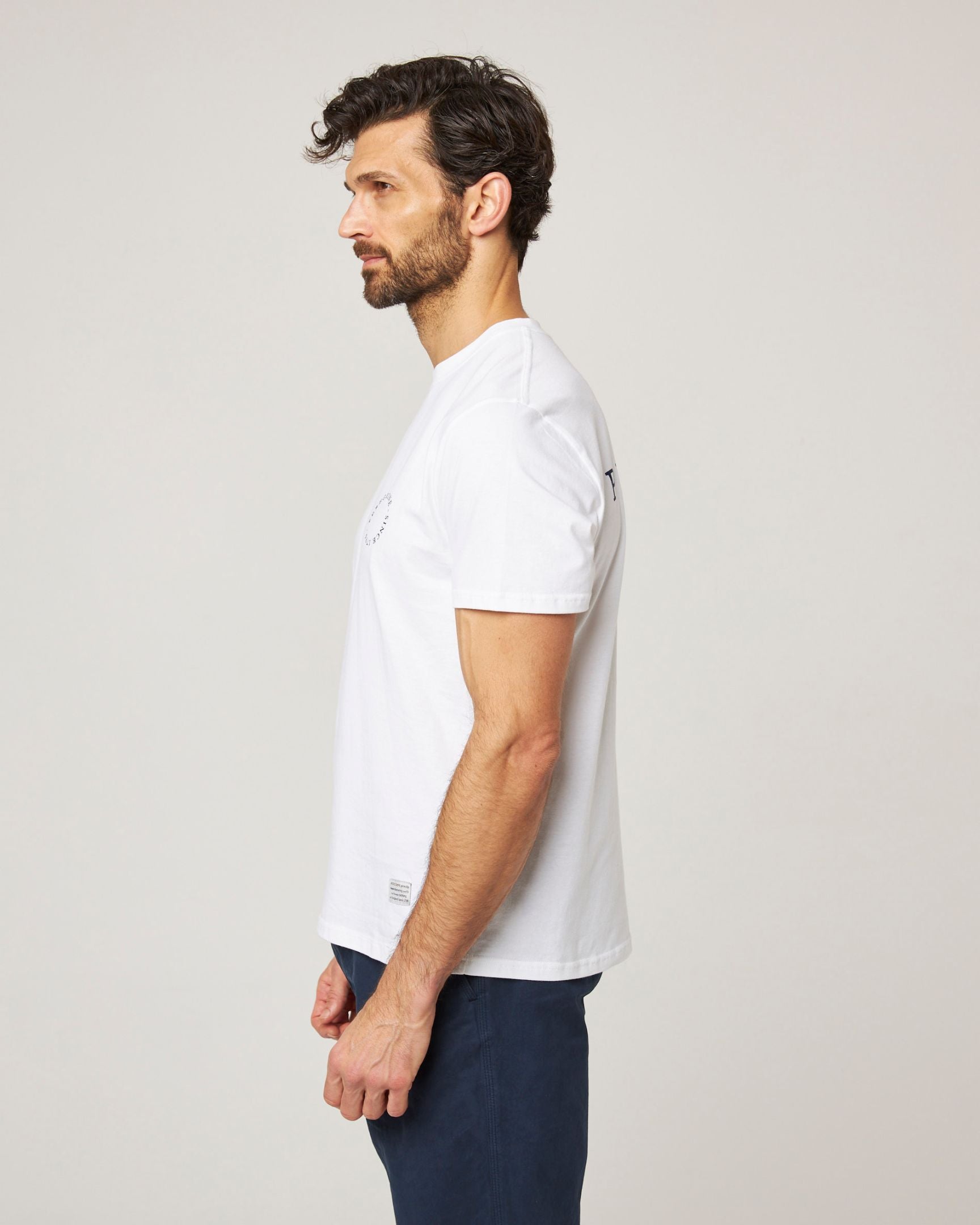 Image of model wearing Peregrine Graphic T-Shirt. 