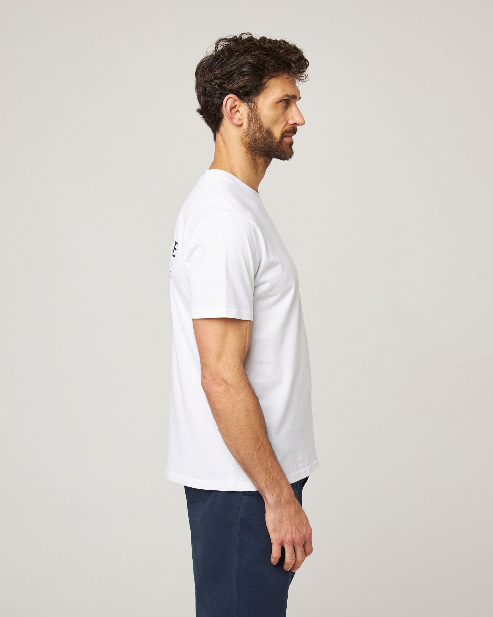 Image of model wearing Peregrine Graphic T-Shirt. 