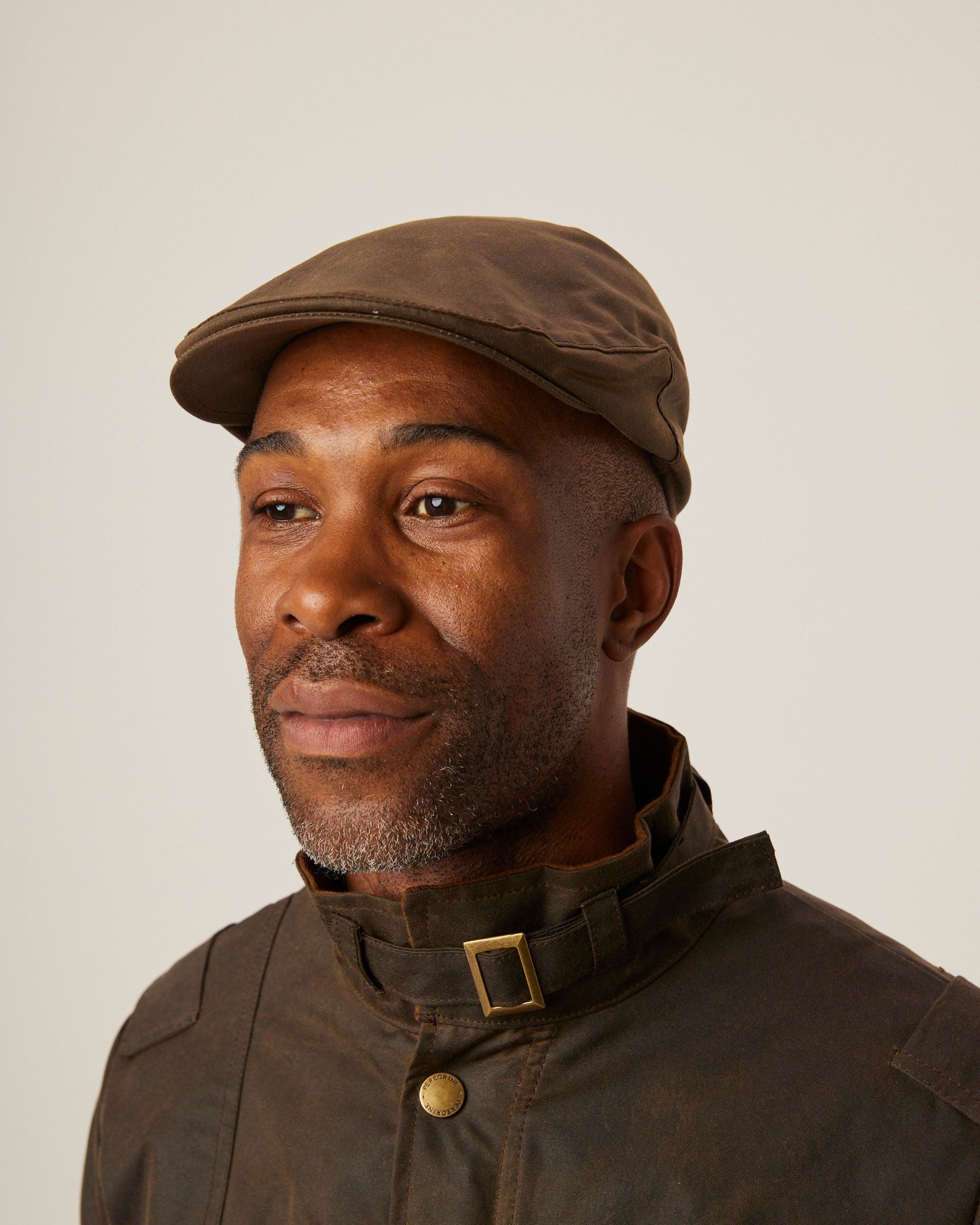 Image of model wearing Wax Flat Cap. 